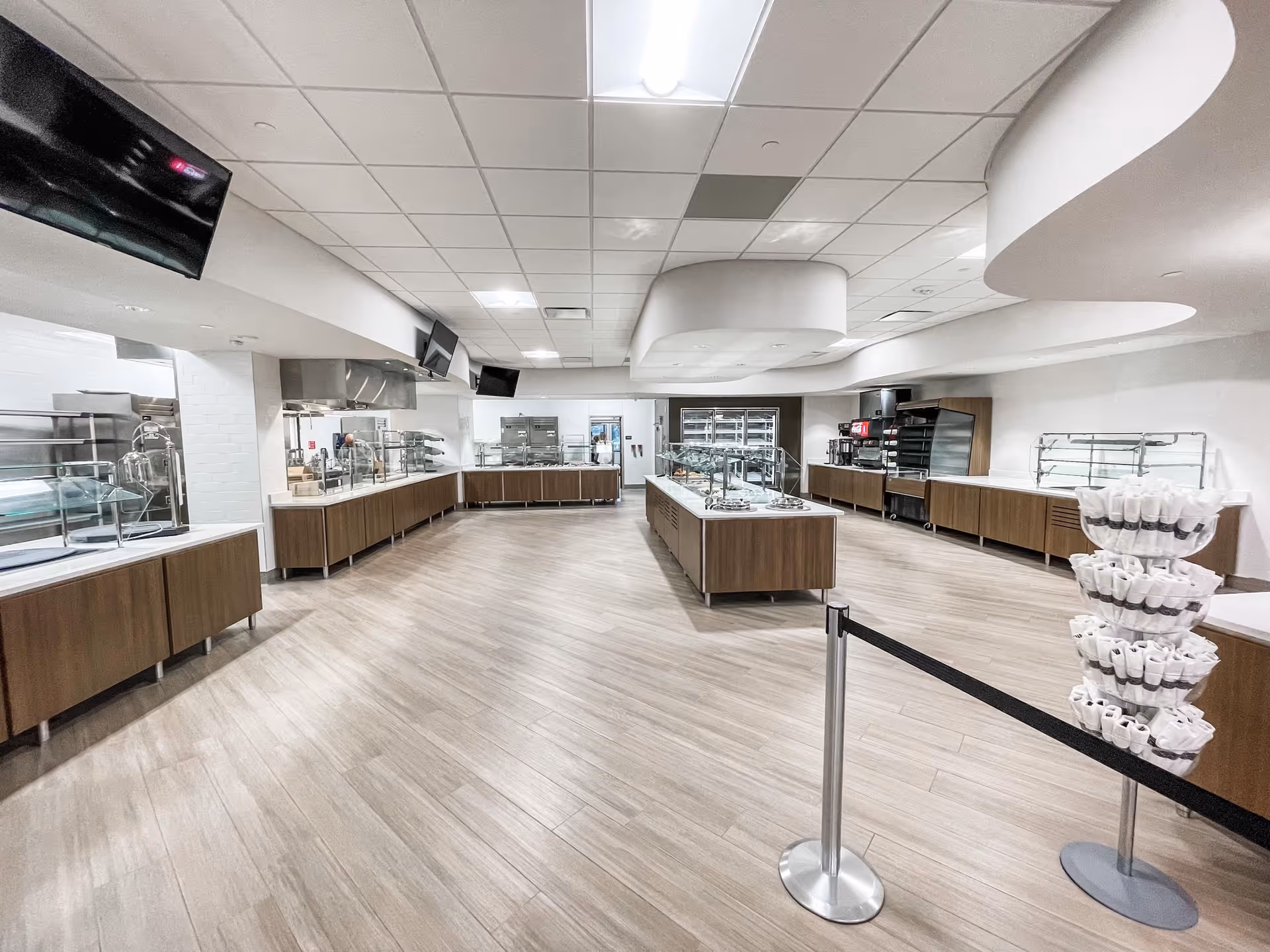 Spacious, modern dining area with service counters and central island.