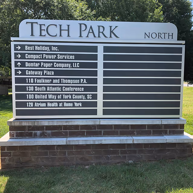 Large outdoor sign reads Tech Park North with tenant directory.