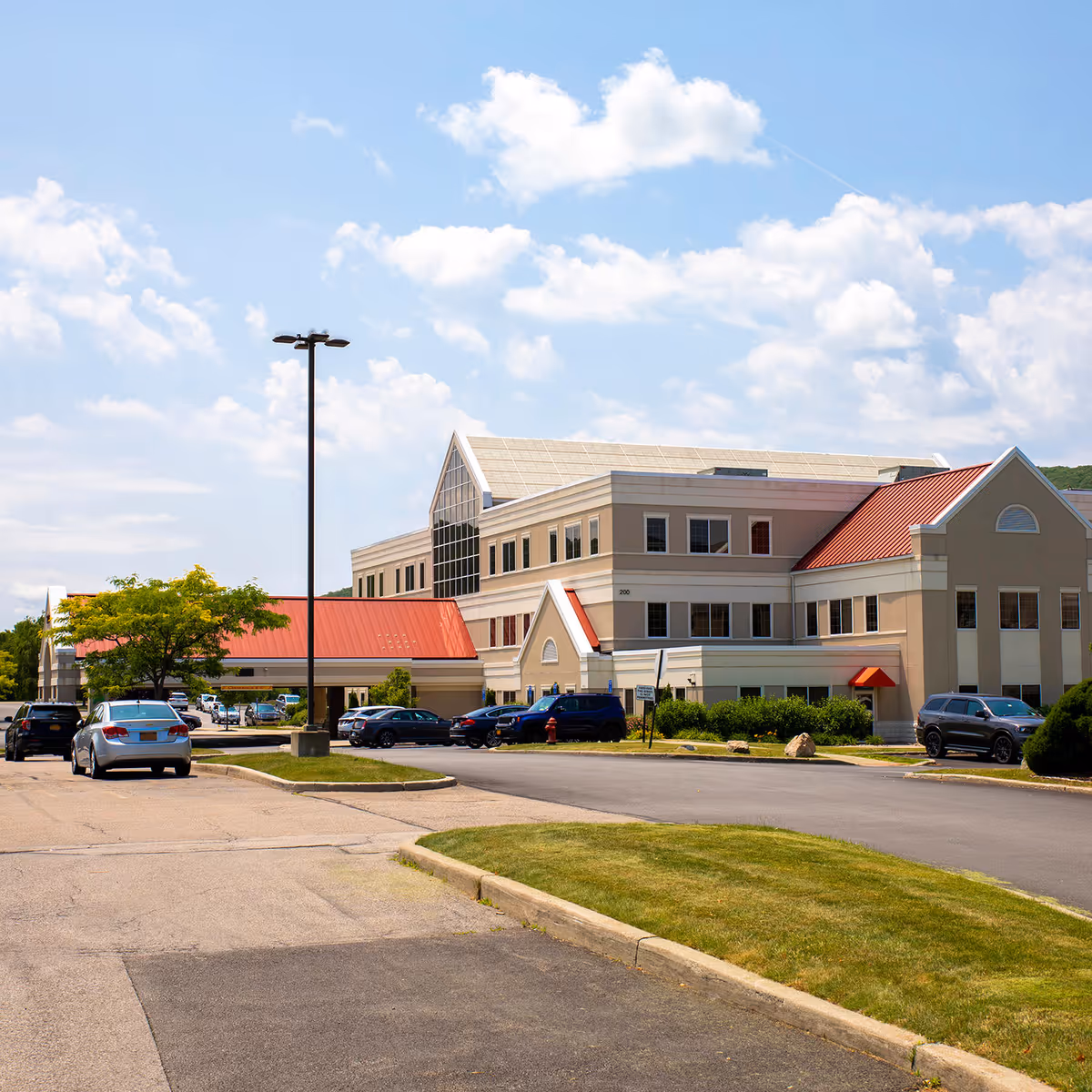 Exterior view of Nuvance Health Physical Rehabilitation at Fishkill with parked cars