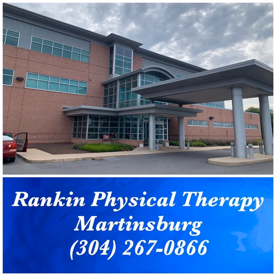Exterior view of Rankin Rehabilitation facility with a covered entrance and blue signage.