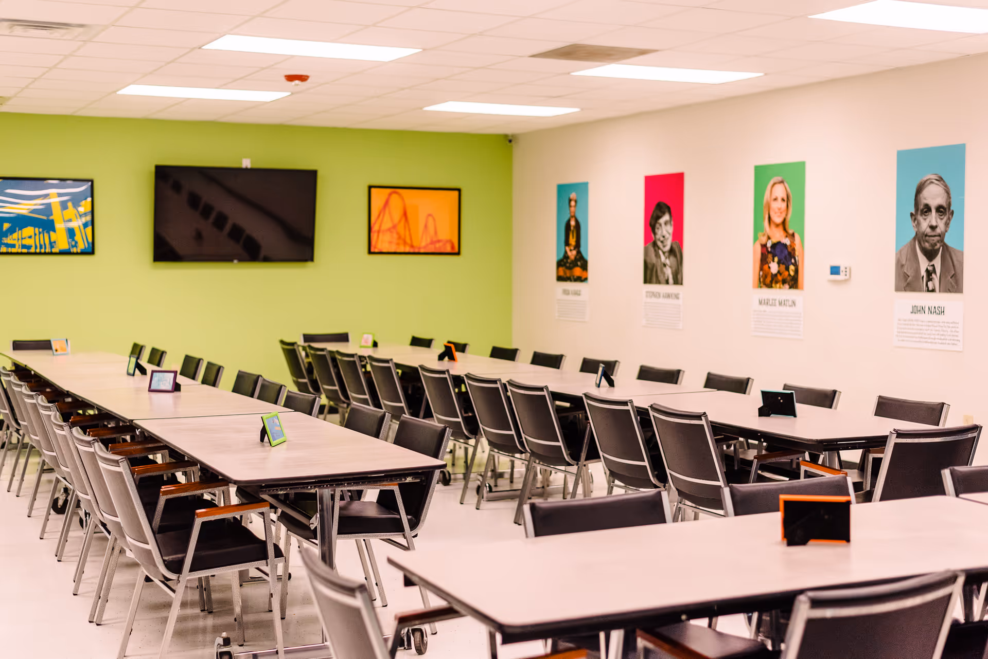 A large multipurpose dining hall with long tables and many chairs.