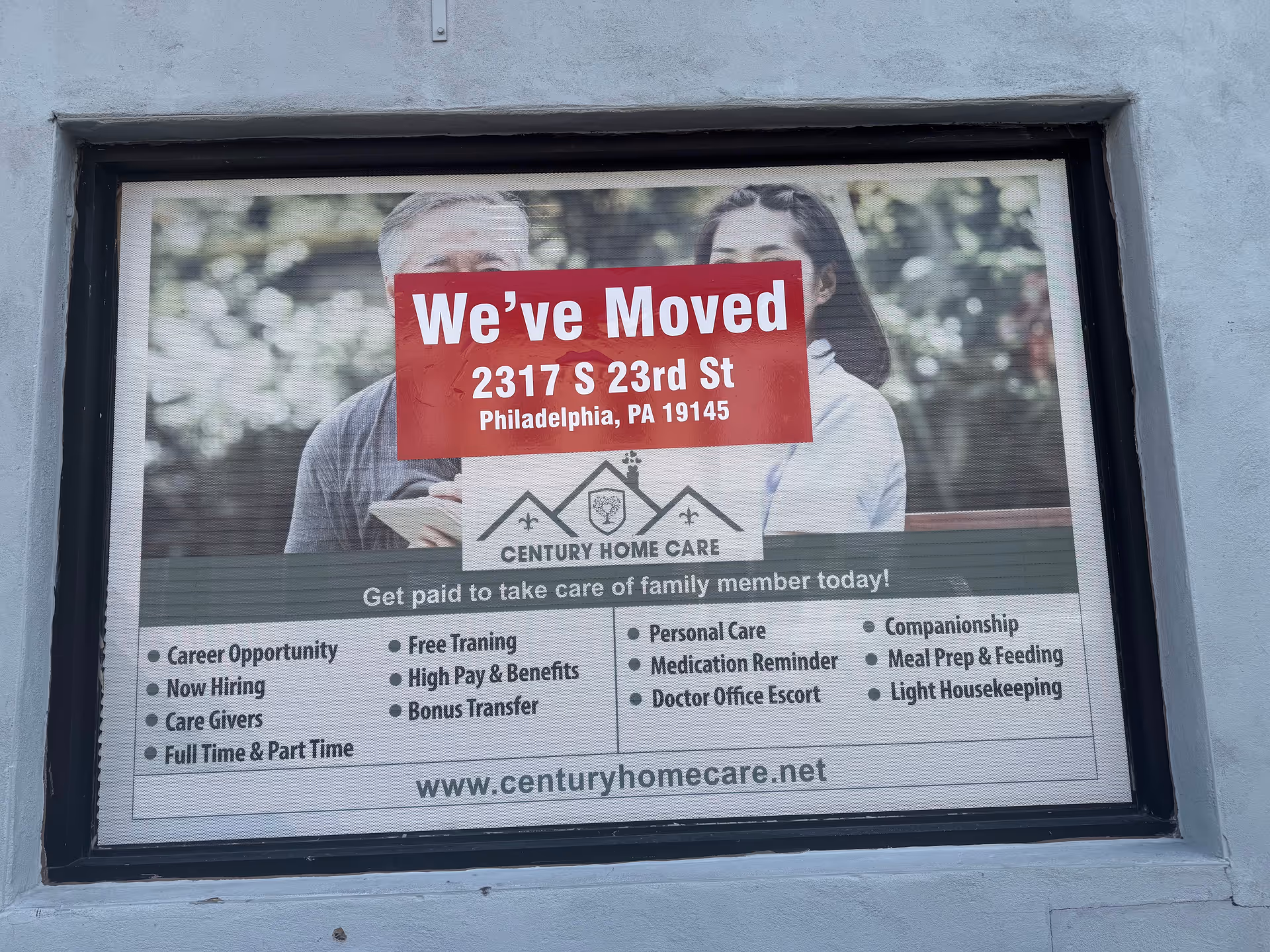 Exterior window sign for Century Home Care LLC announcing move to 2317 S 23rd St, Philadelphia.