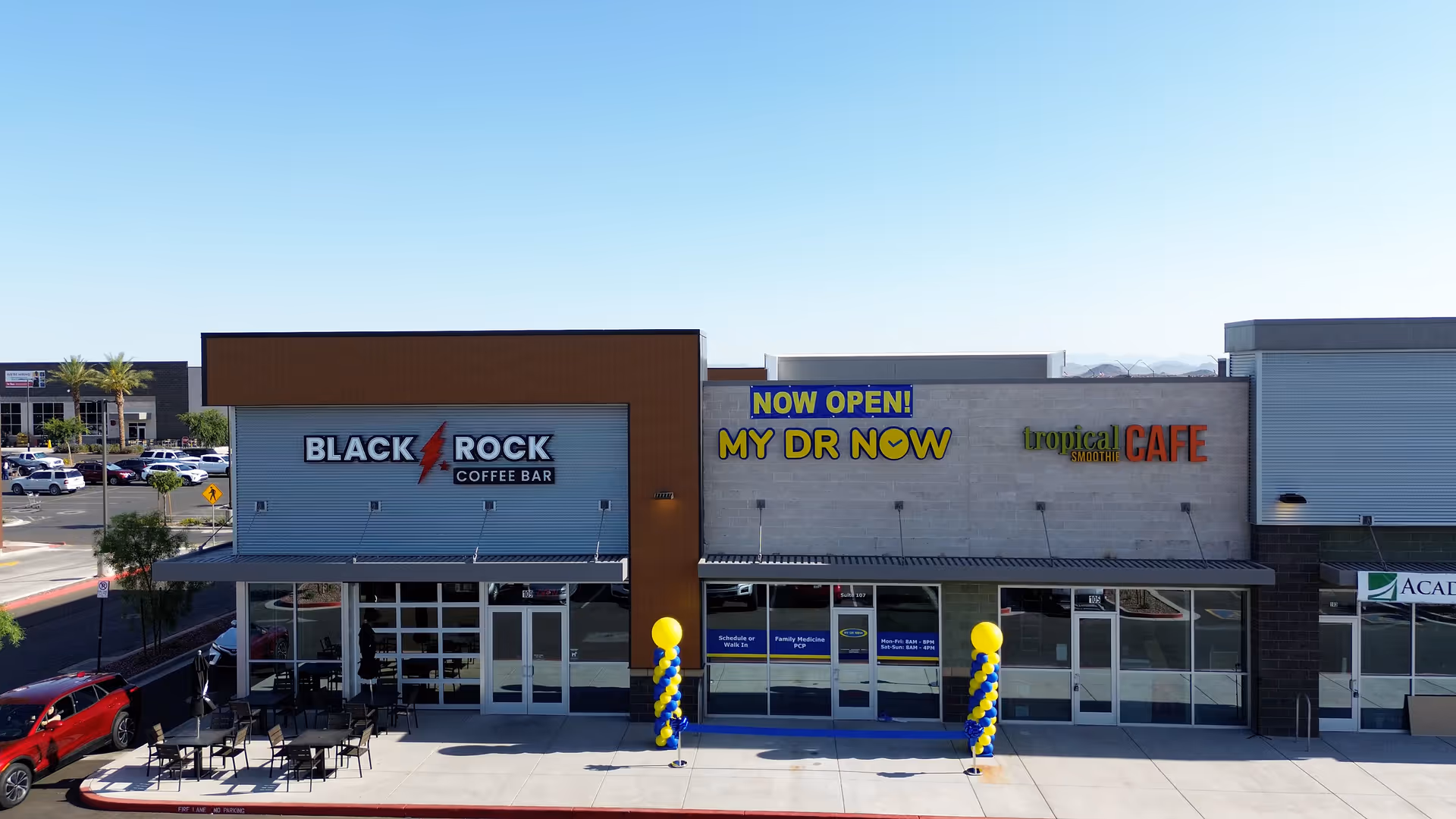 Exterior storefront row with MY DR NOW signage beside Black Rock Coffee Bar.