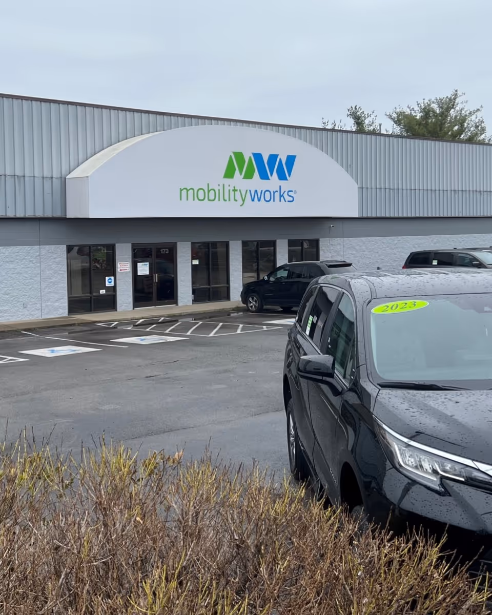 Front facade of MobilityWorks building with a parking lot in the foreground.