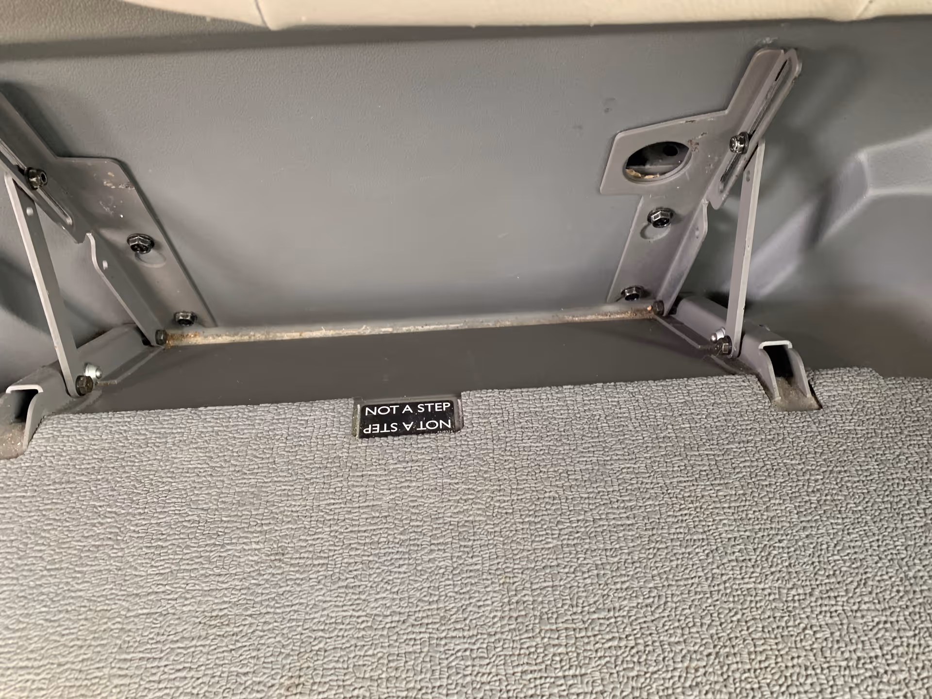 Close-up of MobilityWorks vehicle interior with a lift mechanism and carpeted floor.