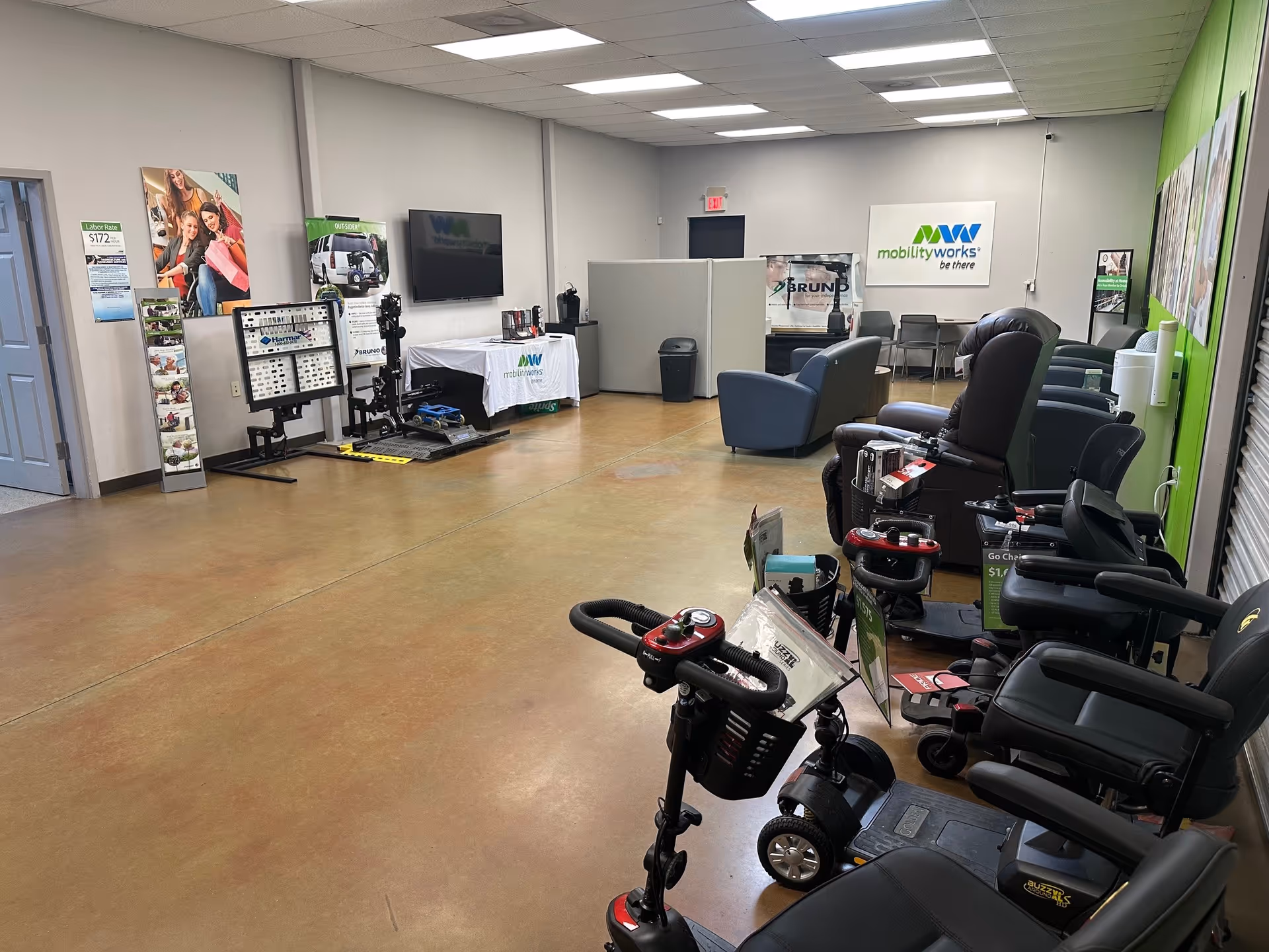 Interior of MobilityWorks showroom with mobility chairs, scooters, and seating along the wall.