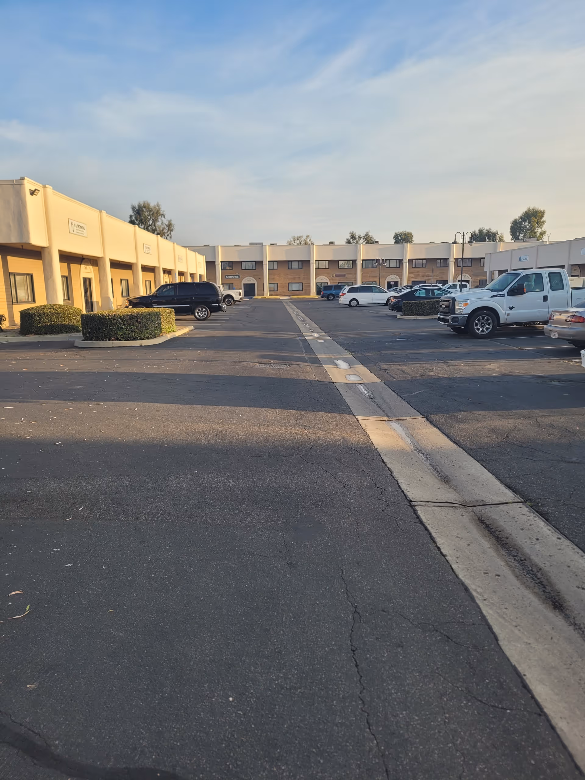 Exterior view of ameriCARE Central Orange County with a parking lot.