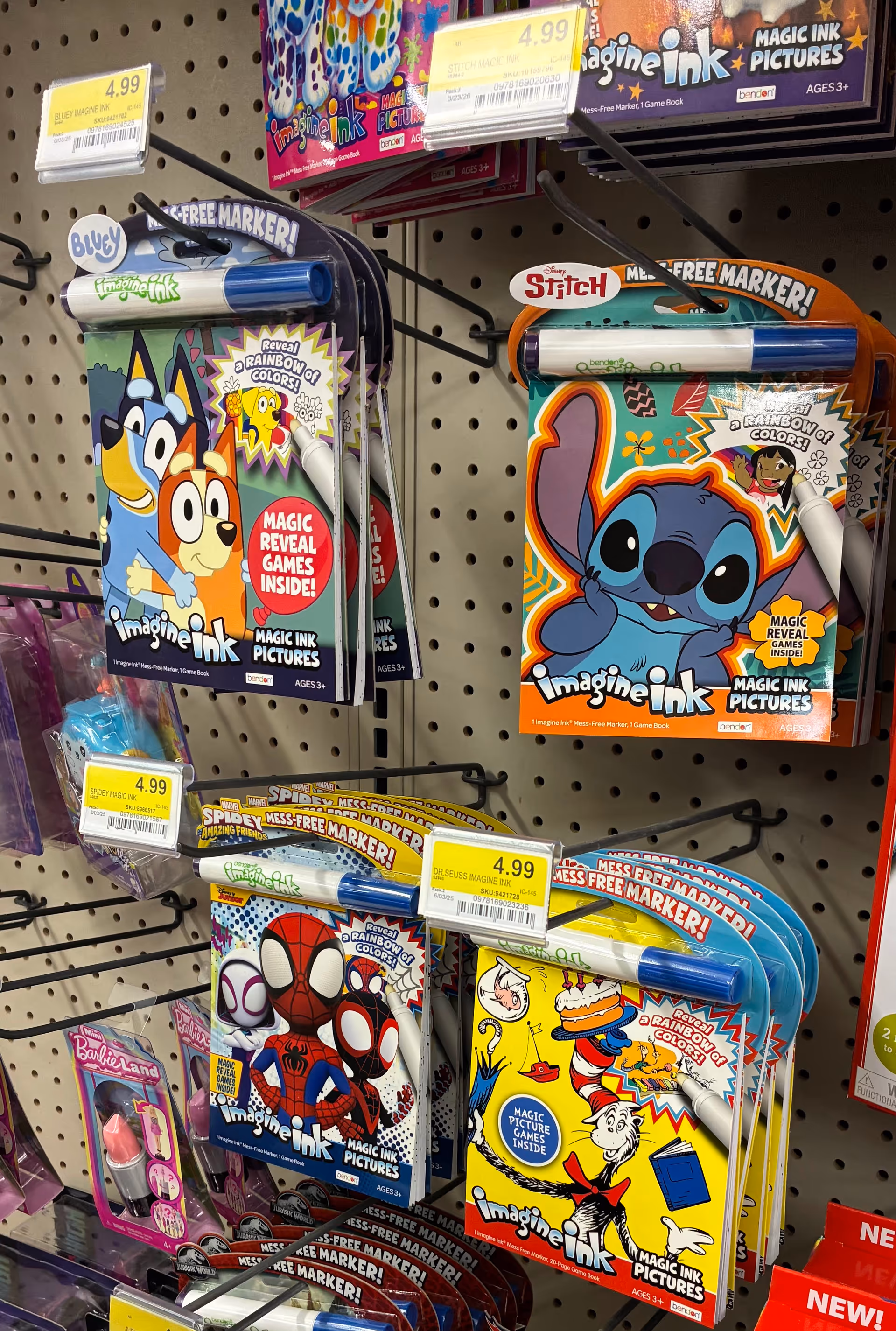 Colorful Imagine Ink marker packs on a pegboard display in store