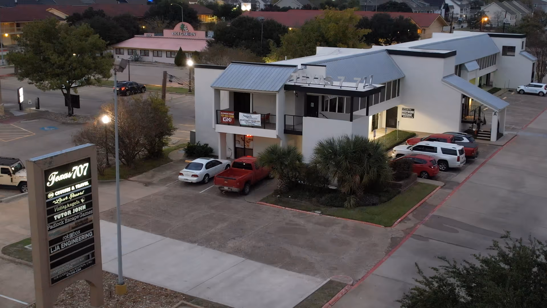 Exterior view of Visiting Angels Senior Home Care building with parking lot and sign.