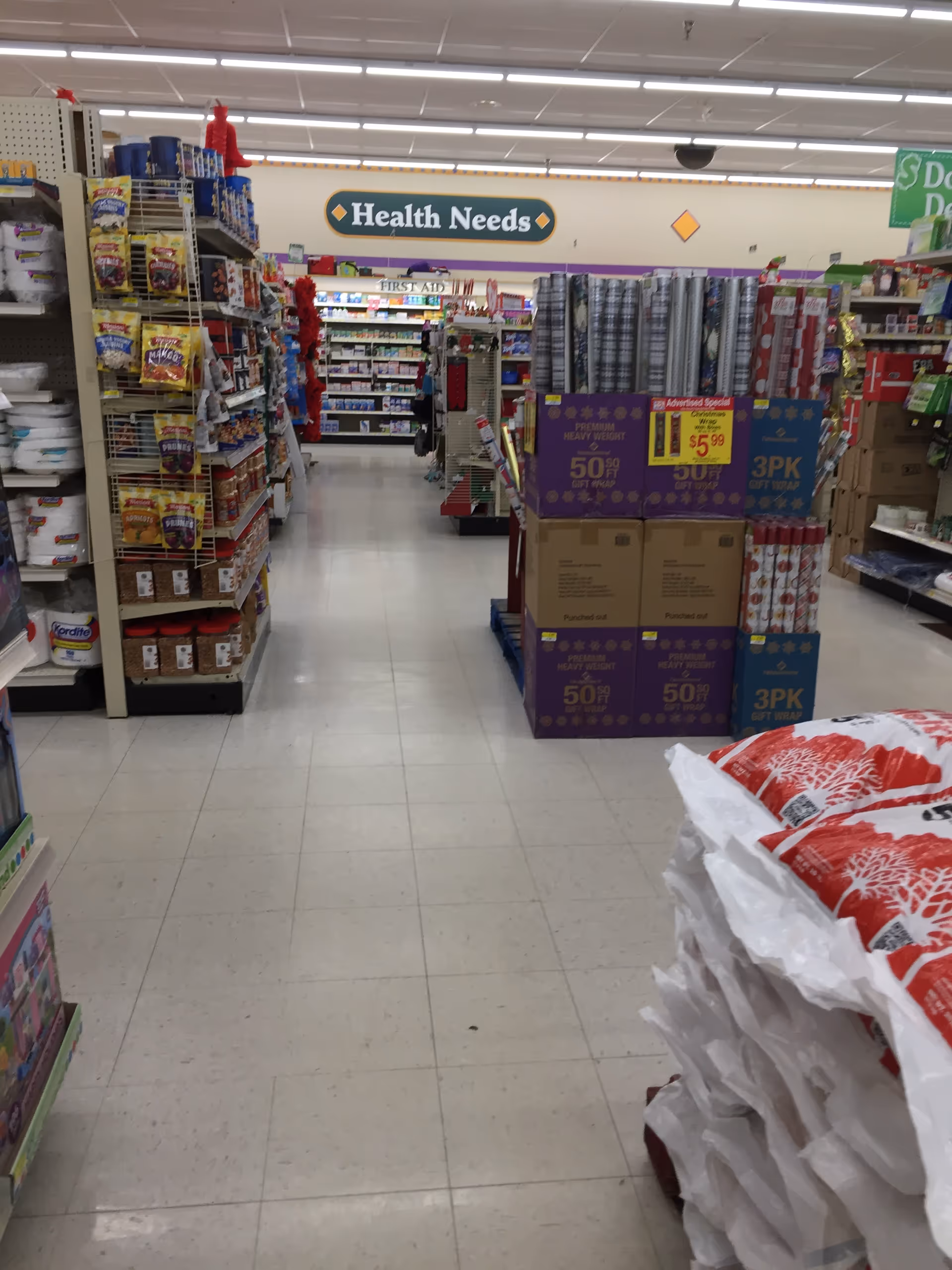 Interior of Discount Drug Mart store with bright aisles and stocked shelves.