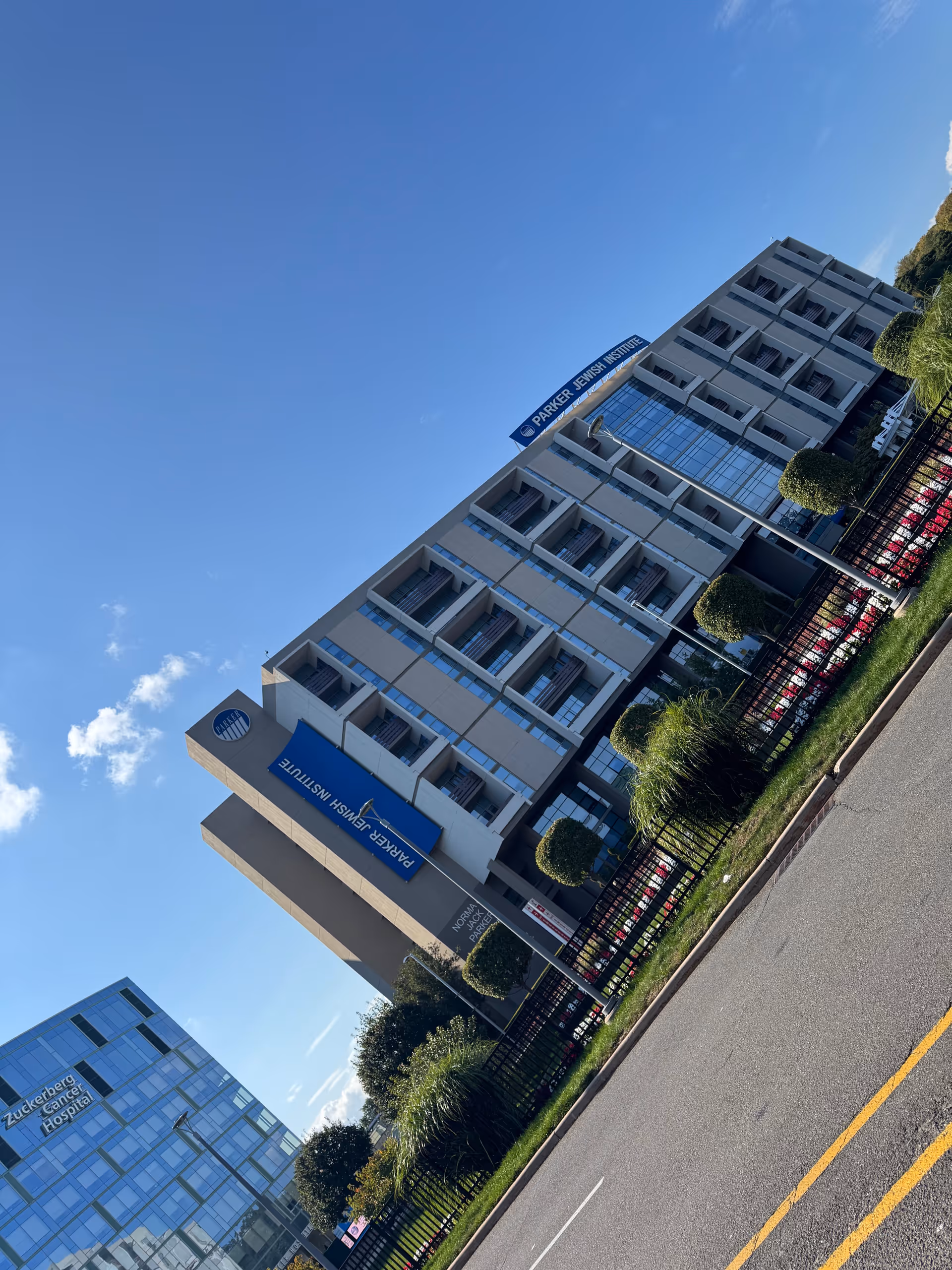 Exterior view of Parker Jewish Institute building against a clear blue sky.