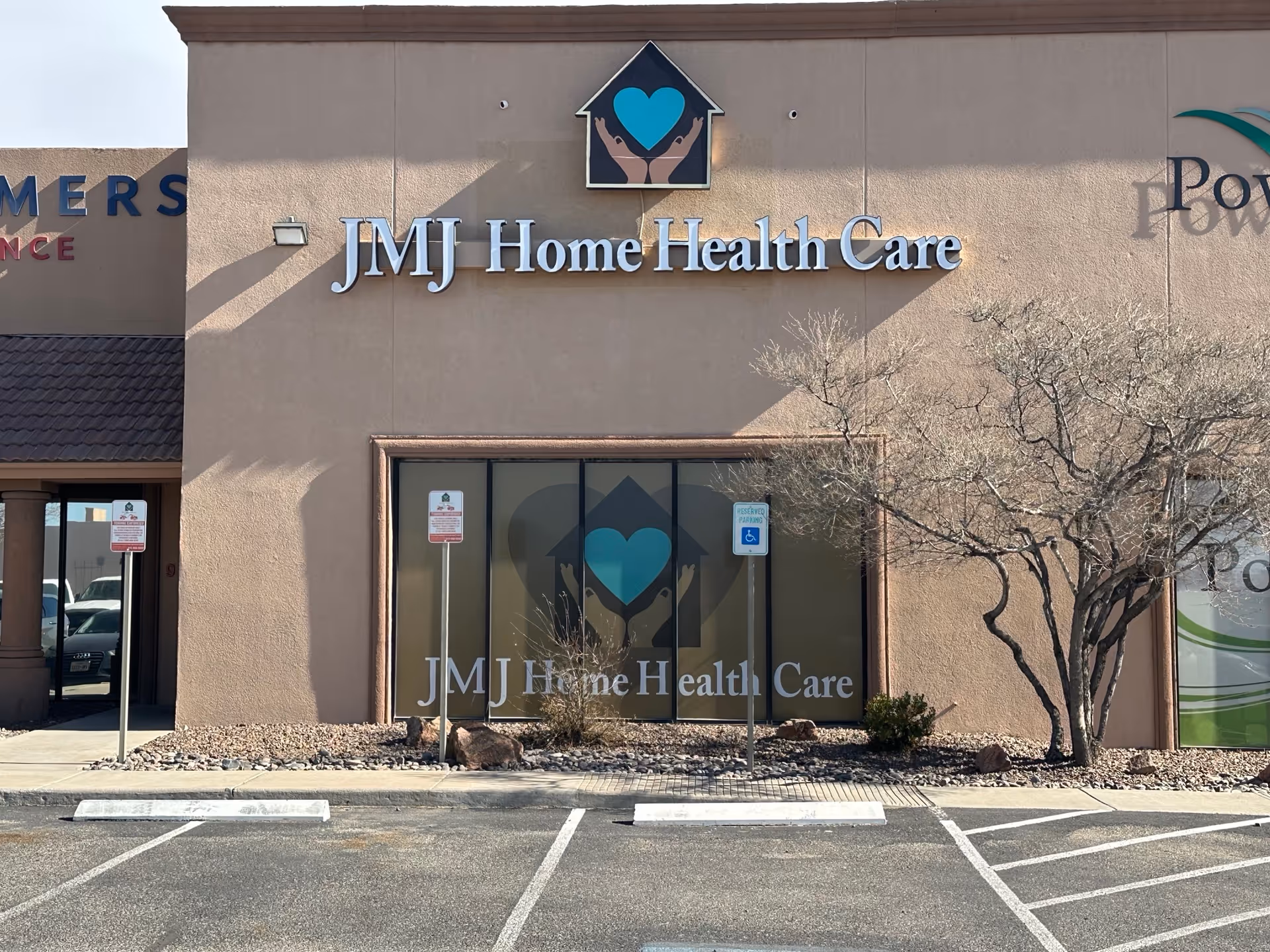 Front view of JMJ Home Health Care building with sign and parking lot.