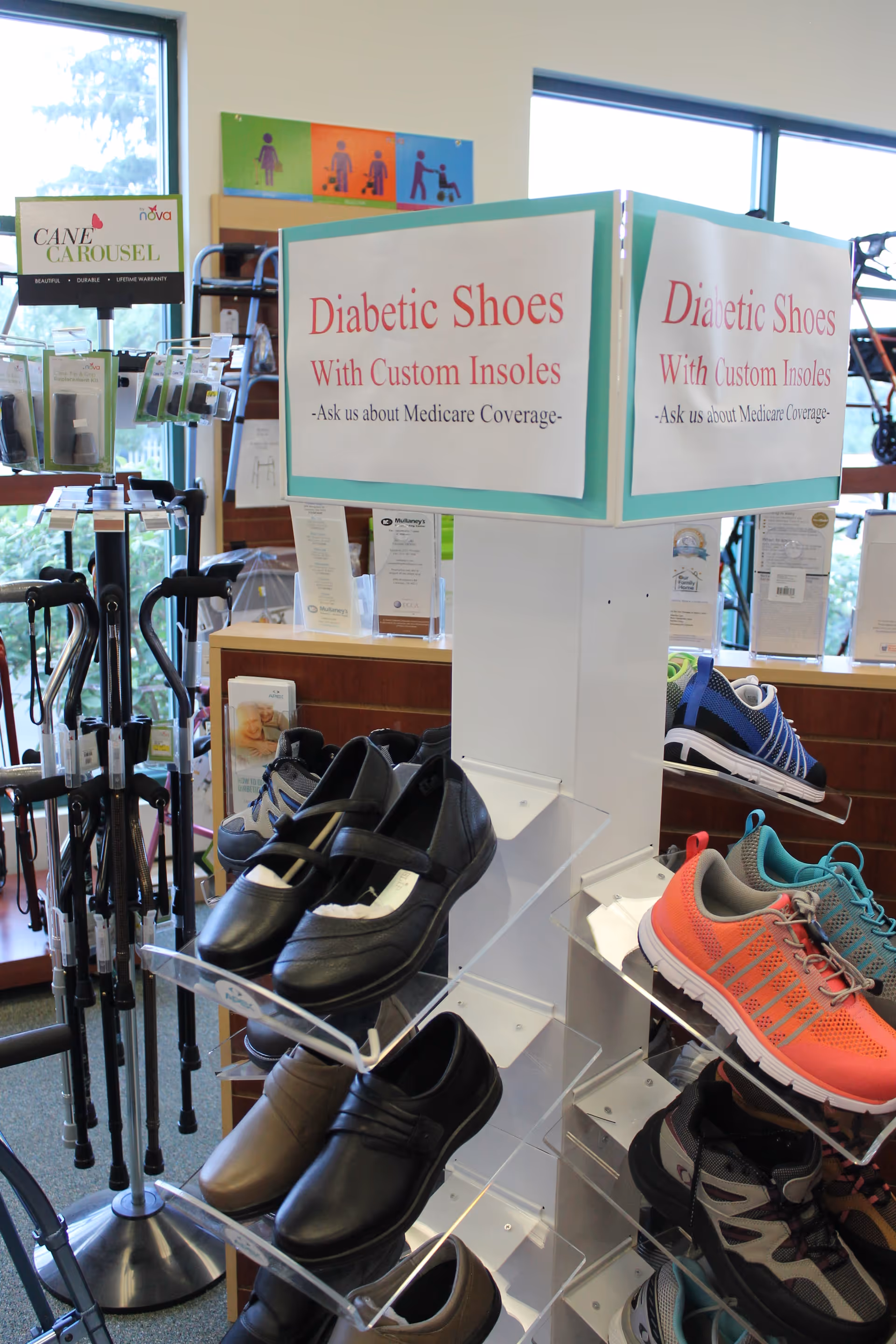 Interior store area displaying diabetic shoes with custom insoles and walking aids.