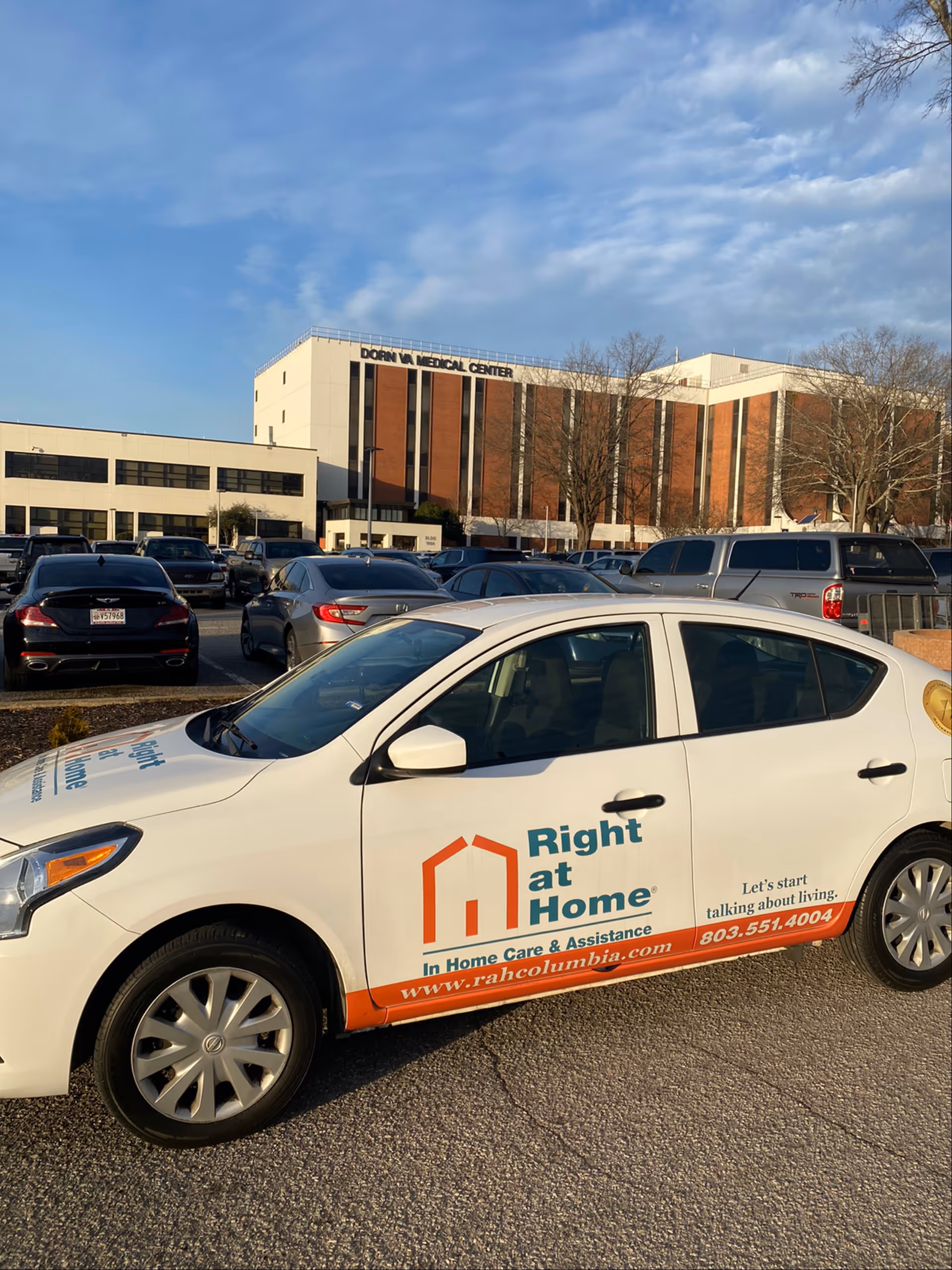 Right at Home vehicle parked in front of a medical center building.