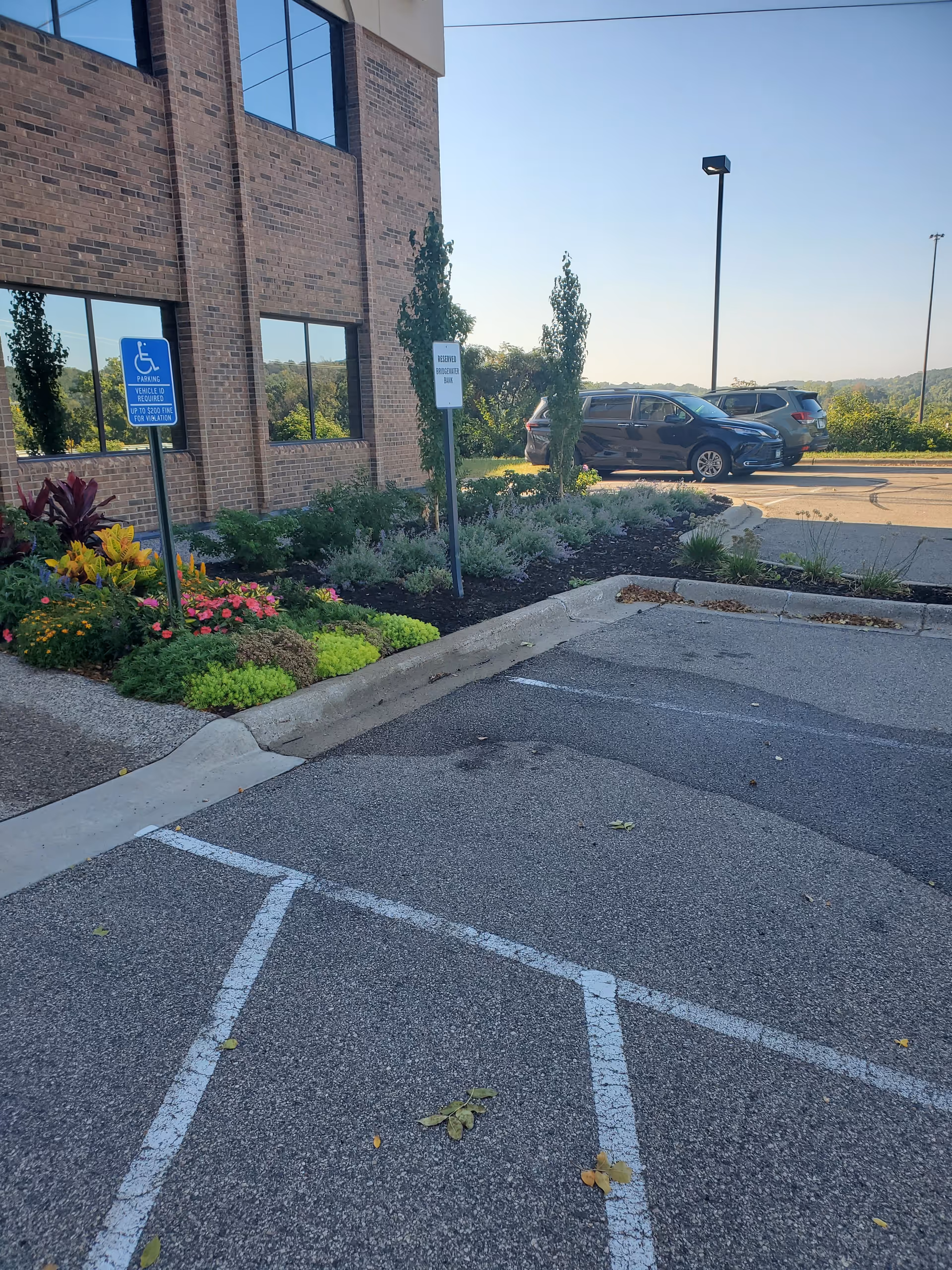 Exterior view of St. Croix Hospice building with parking lot and landscaped entrance.