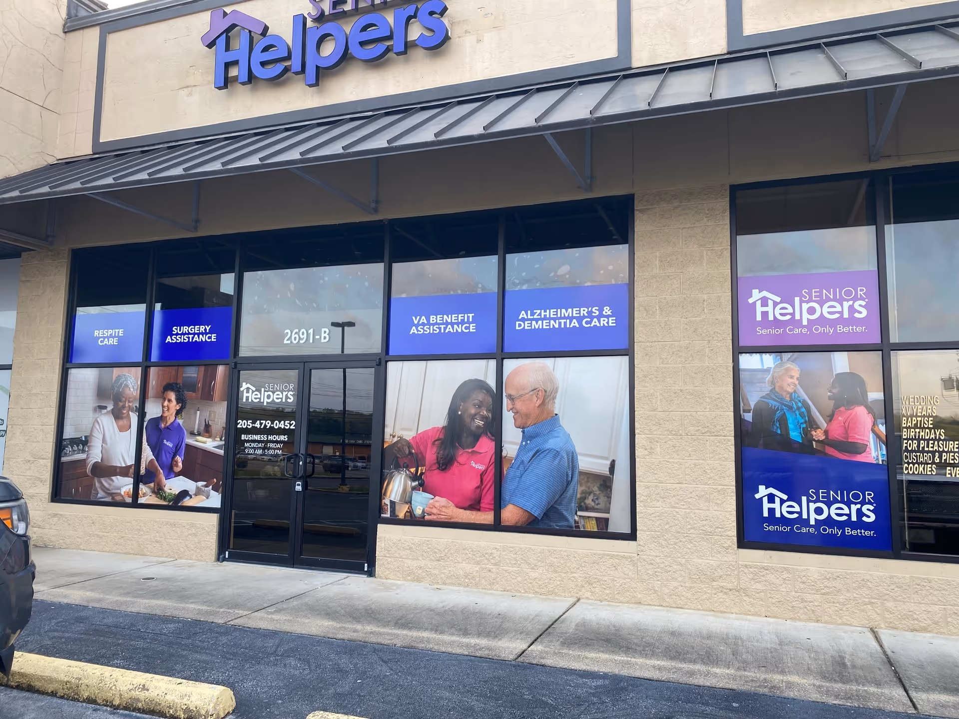 Exterior of Senior Helpers storefront with large window banners depicting caregivers and seniors.