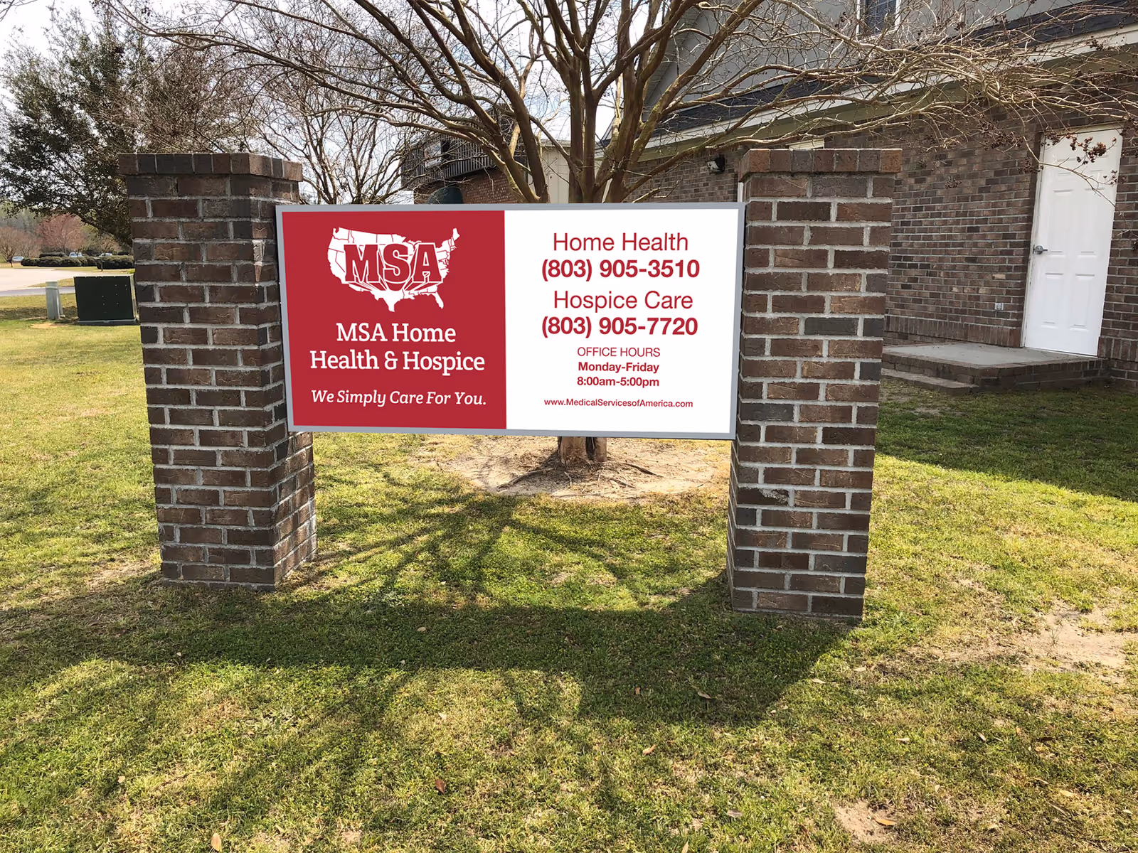 Brick entrance with freestanding MSA Home Health & Hospice sign on grass