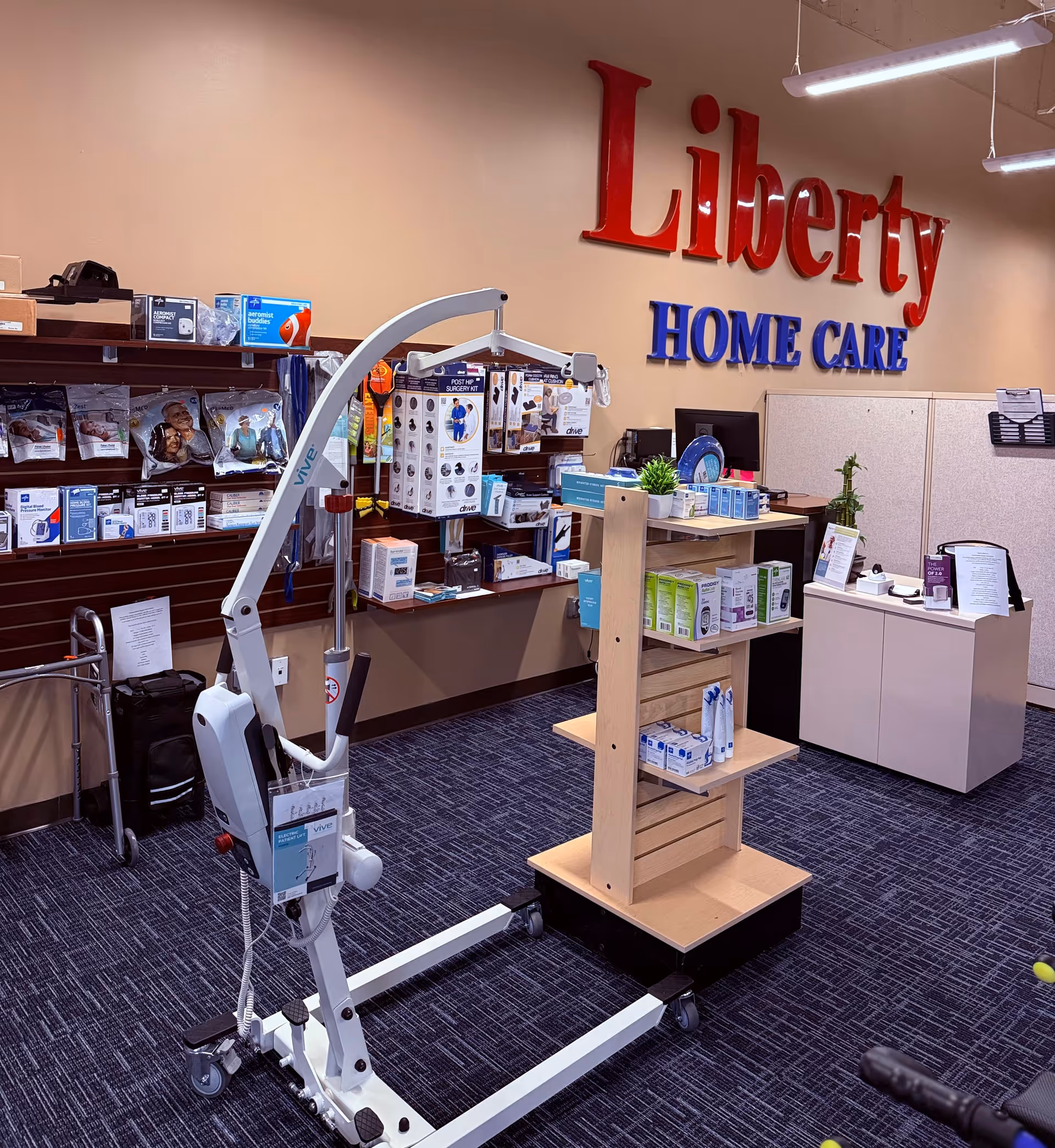 Interior of Liberty Home Care with medical equipment display, shelving, and mobility device.