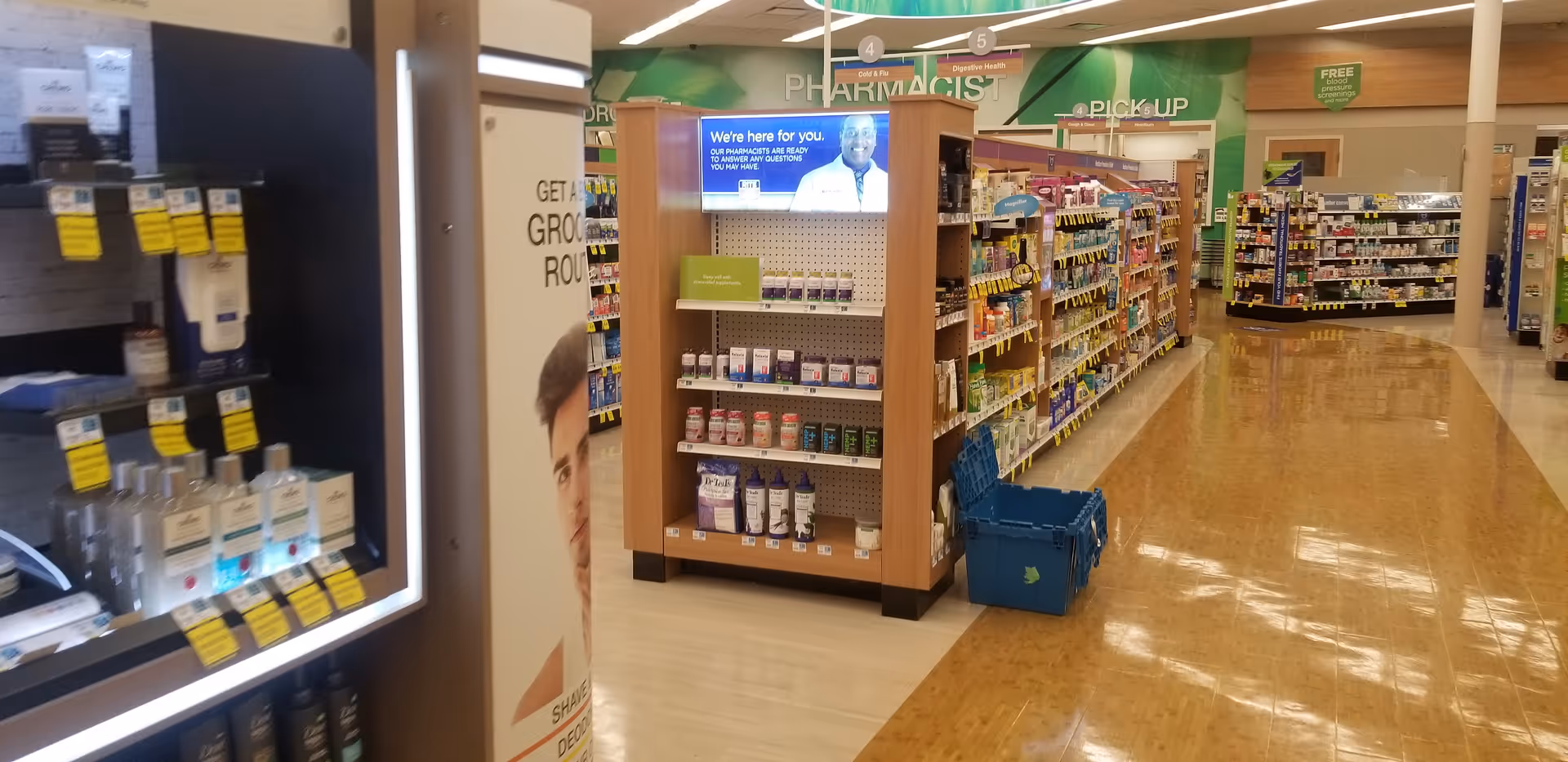 Interior view of Discount Drug Mart pharmacy aisle with shelves and polished floor