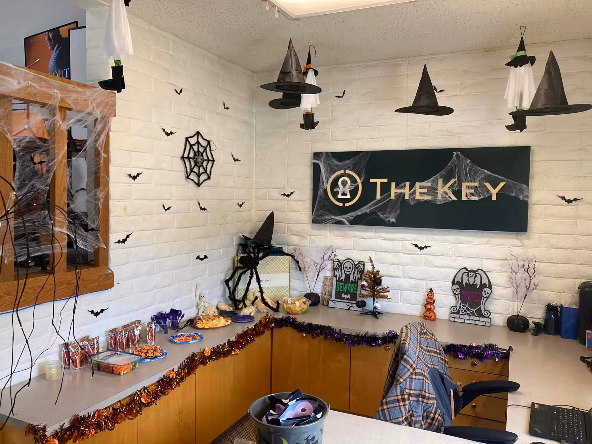 Indoor reception area decorated for Halloween at TheKey Senior Home Care facility.