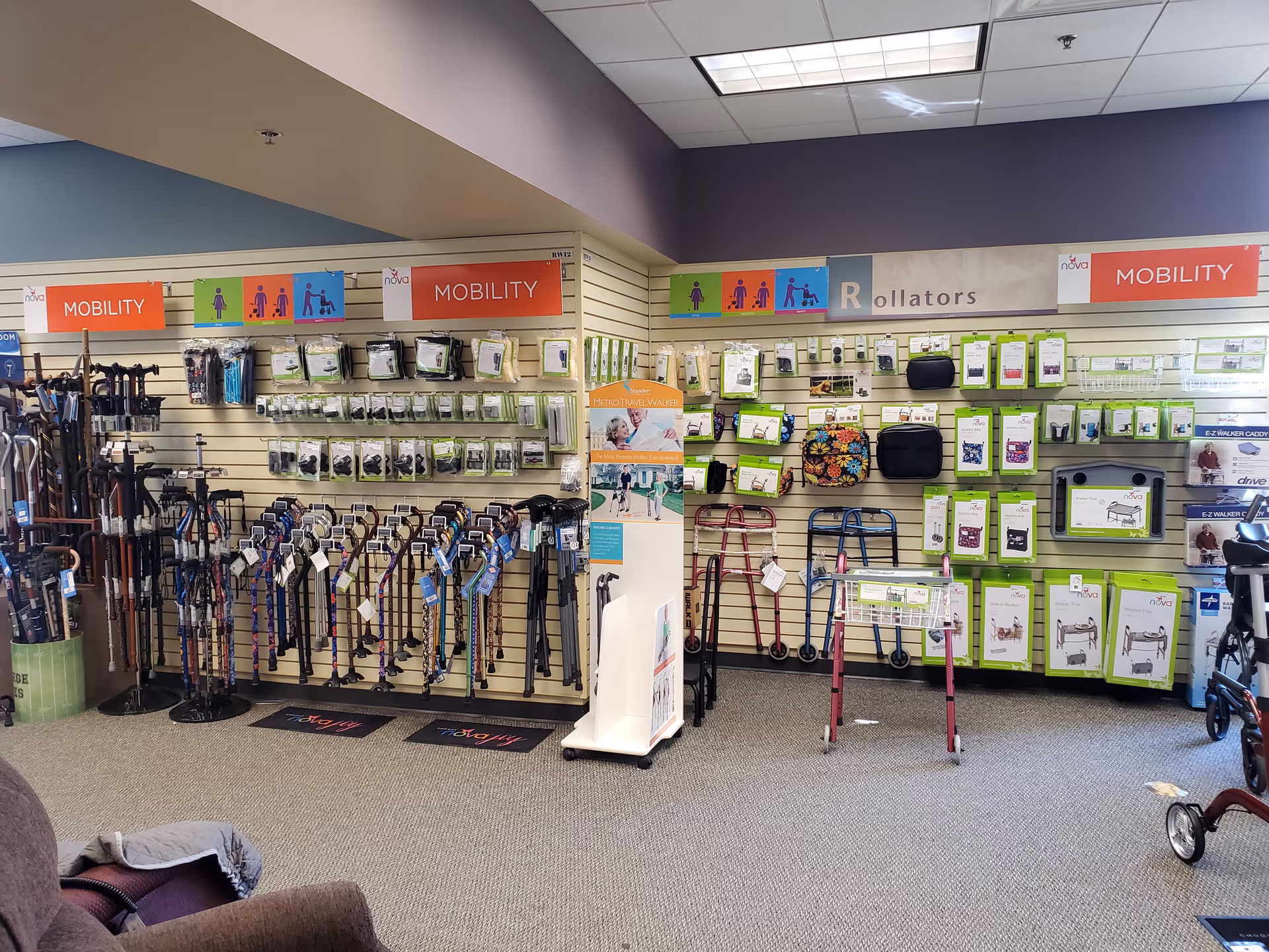 Indoor mobility aids display with walkers, canes, and accessories.