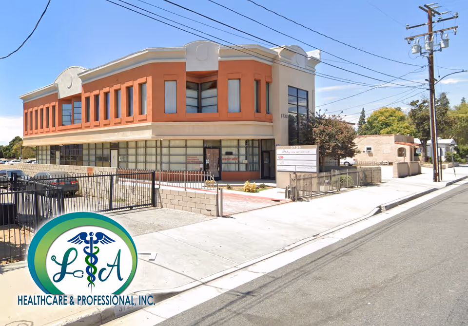 Two-story brick and beige medical building on a street, with LA Healthcare & Professional, Inc. logo.
