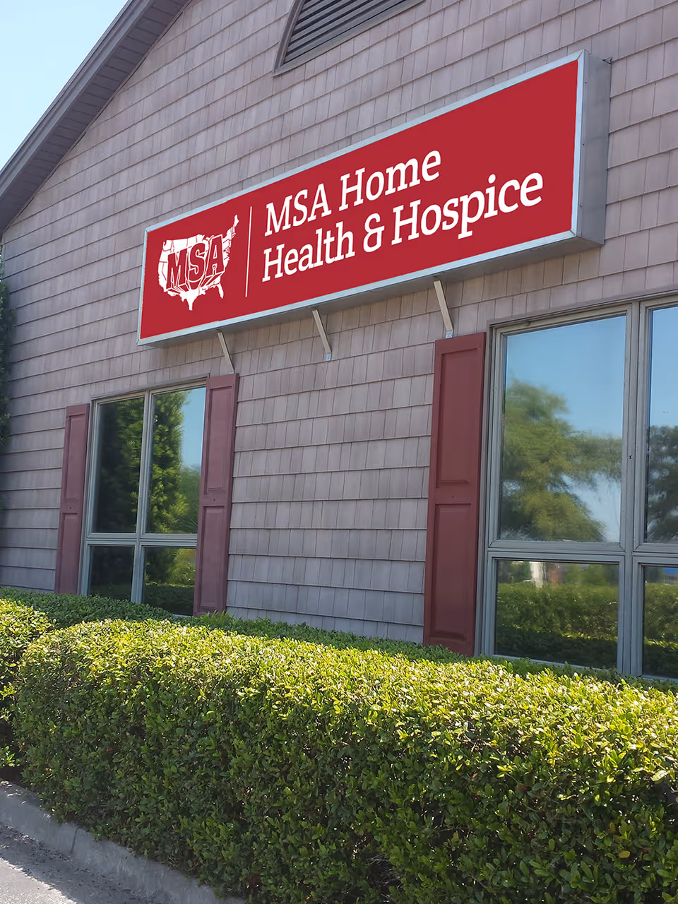 Exterior view of a facility with a red MSA Home Health & Hospice sign.
