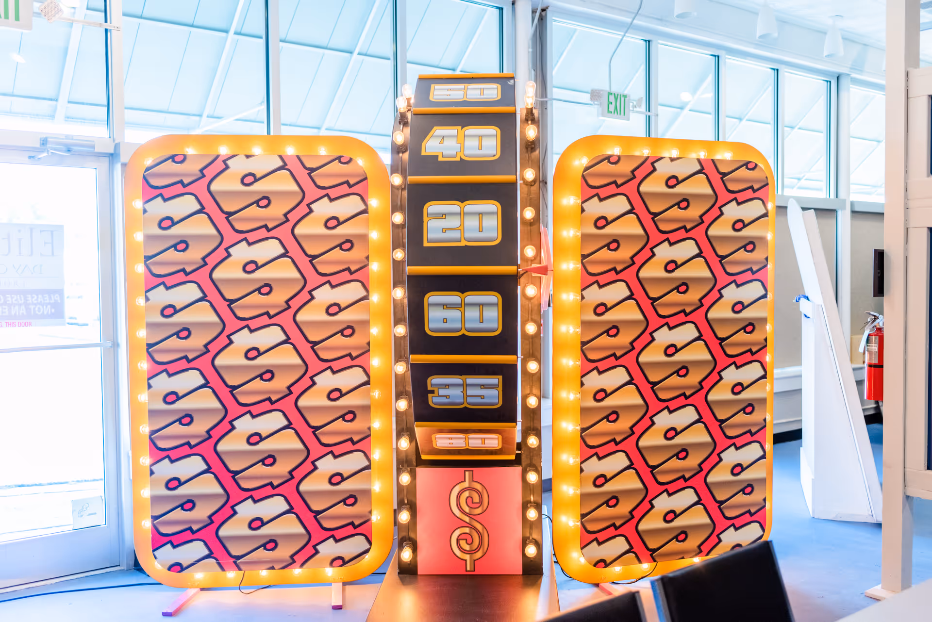 Bright interior at Elite Home Care featuring a colorful game show scoreboard and panels.