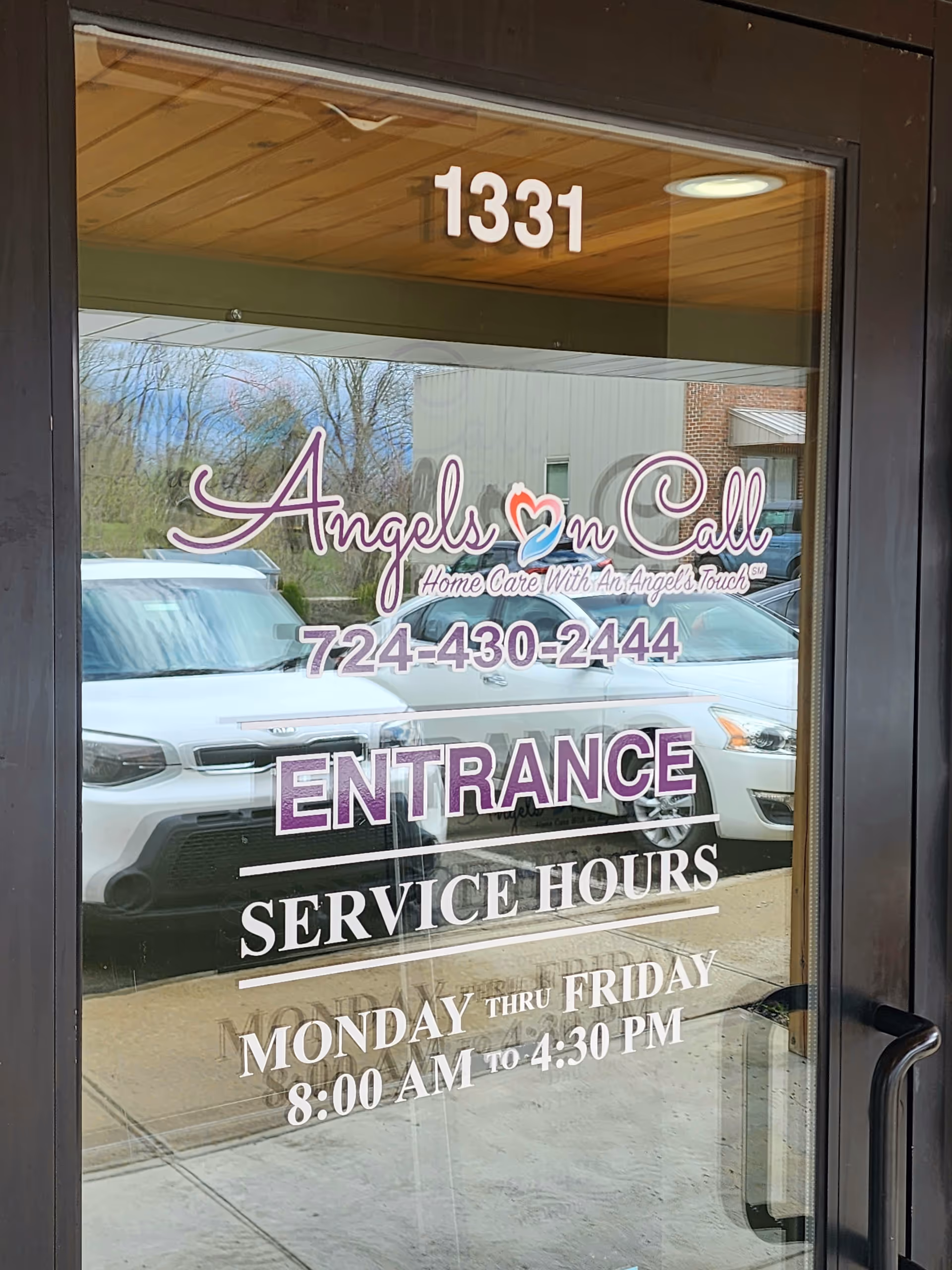 Entrance door displaying Angels On Call Home Care signage and service hours.