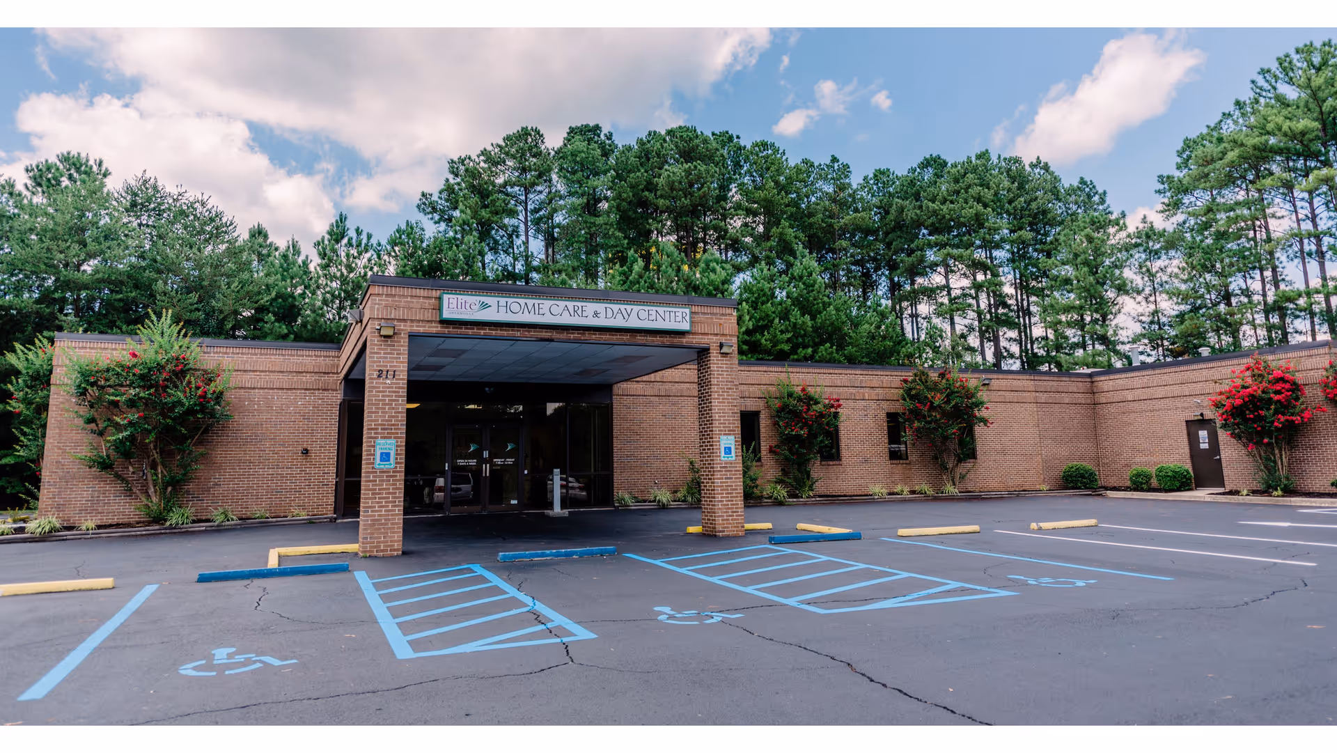Exterior view of Elite Home Care and Day Center with parking and handicap spaces.