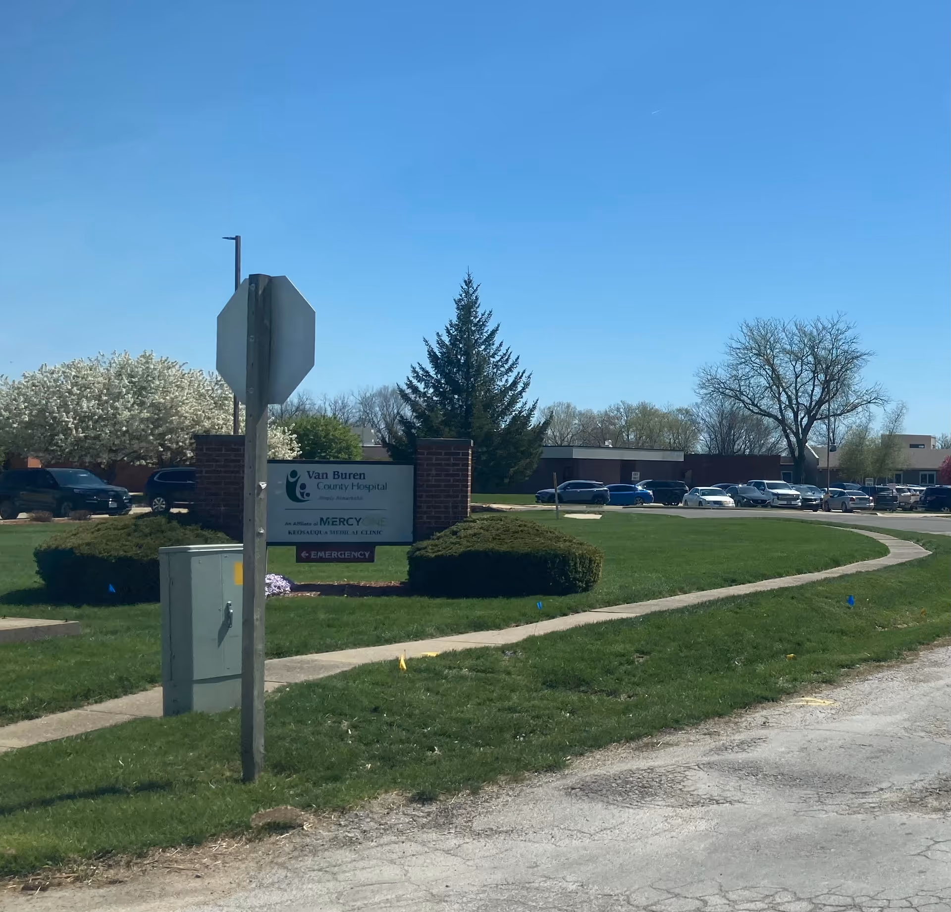 Exterior view of Van Buren County Hospital with sign, driveway, and parking