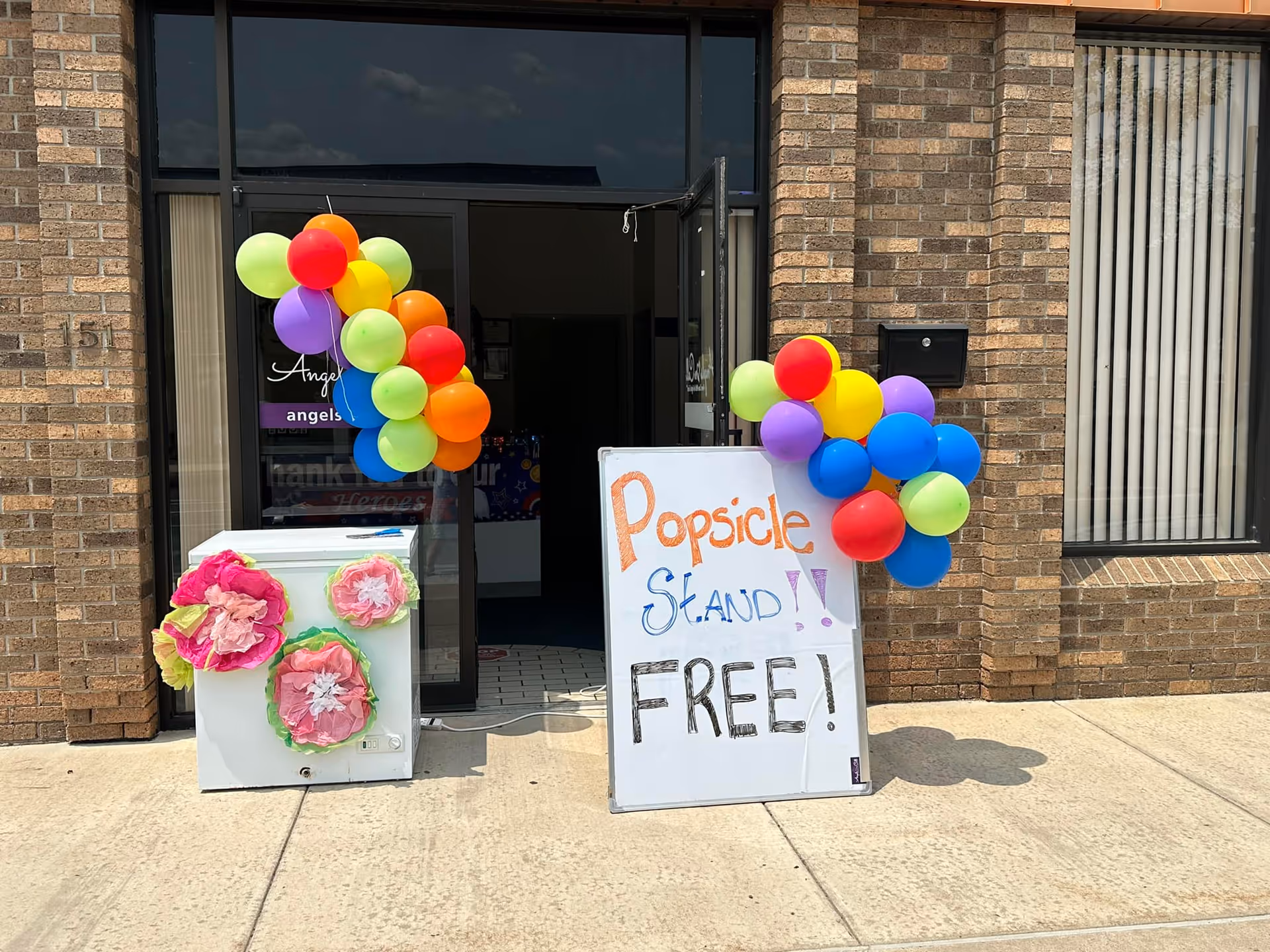 Colorful balloons decorate the brick entrance of Angels On Call Home Care.