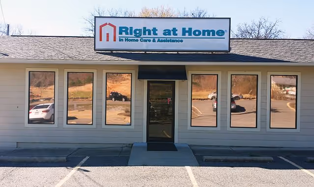 Front view of a Right at Home facility with windows and entrance.
