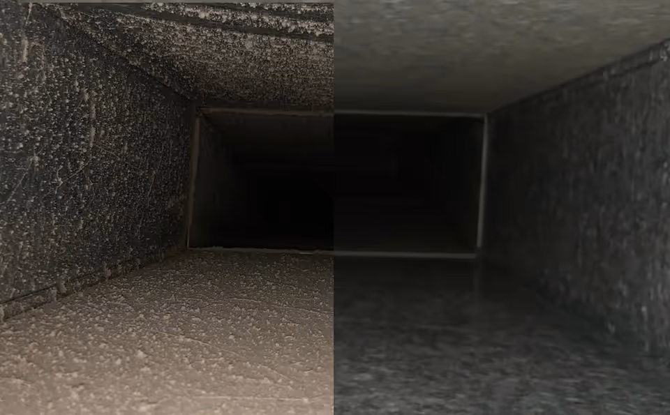 A dark, narrow rectangular ventilation shaft receding into shadowed concrete interior.