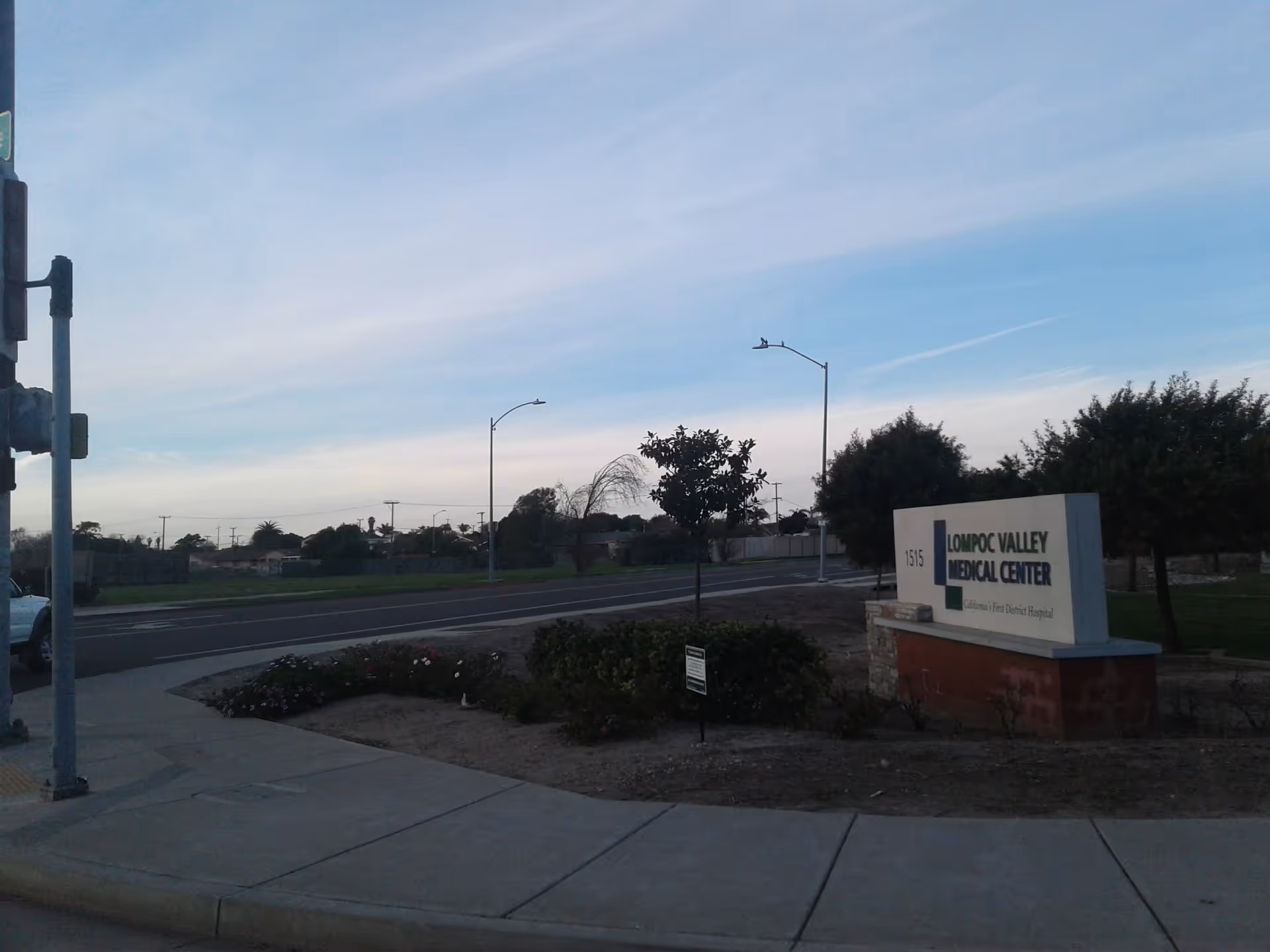 Exterior view of the Lompoc Valley Medical Center sign by the street.