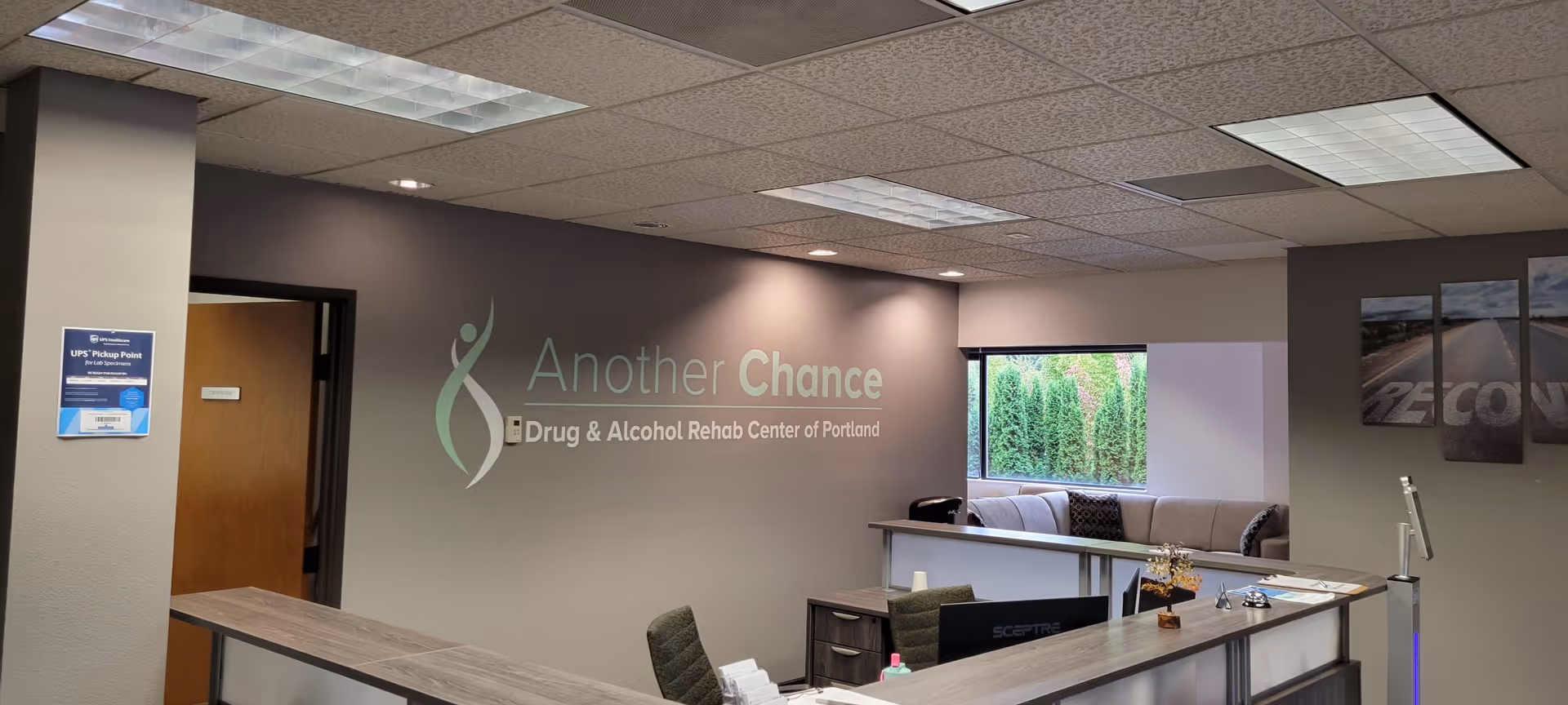 Reception area inside Another Chance Drug & Alcohol Rehab Center of Portland with a curved desk.