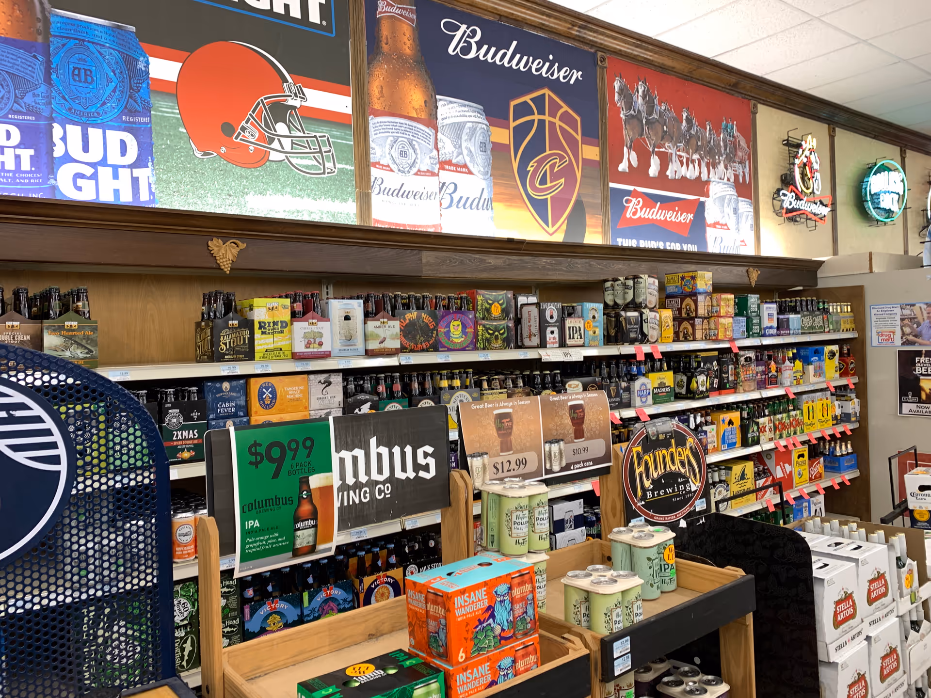 Interior view of a Discount Drug Mart aisle with beer, liquor, and shelves.
