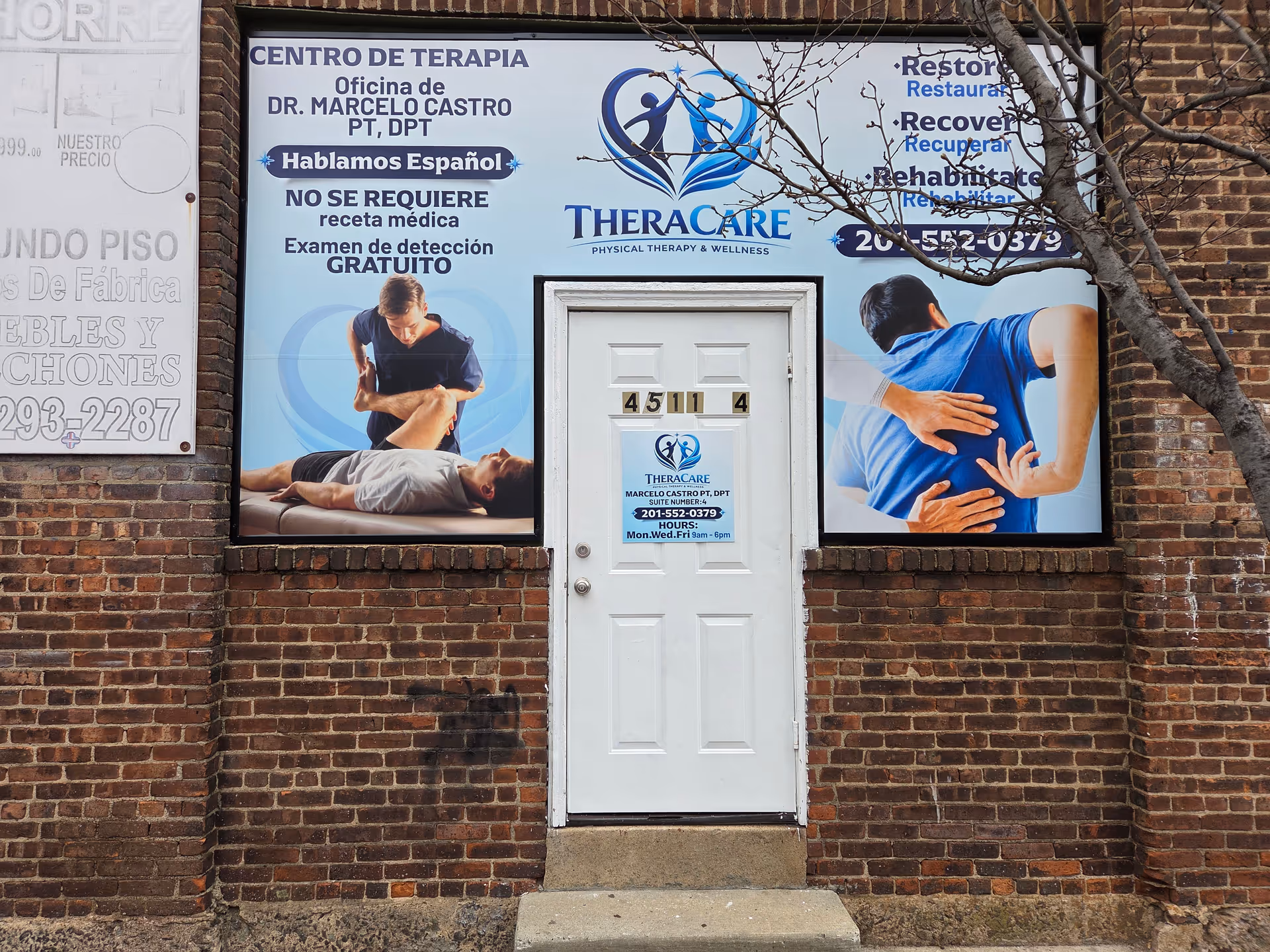 Brick storefront with TheraCare signage and therapy posters framing a white door.