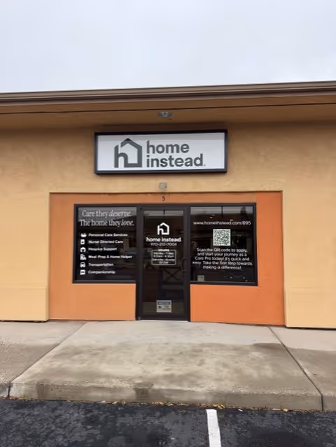 Front entrance of a Home Instead office with a sign above the door.