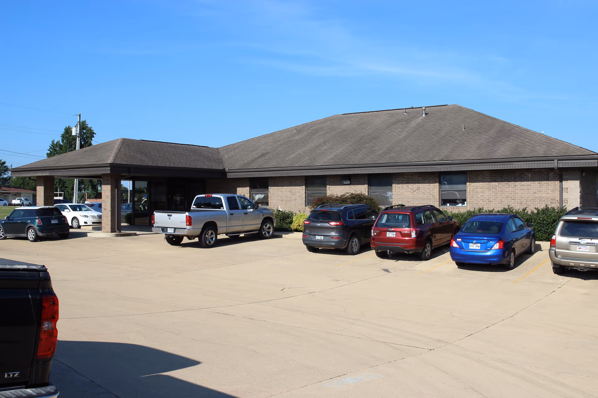 Exterior of Baxter Health Home Health building with a parking lot in front.