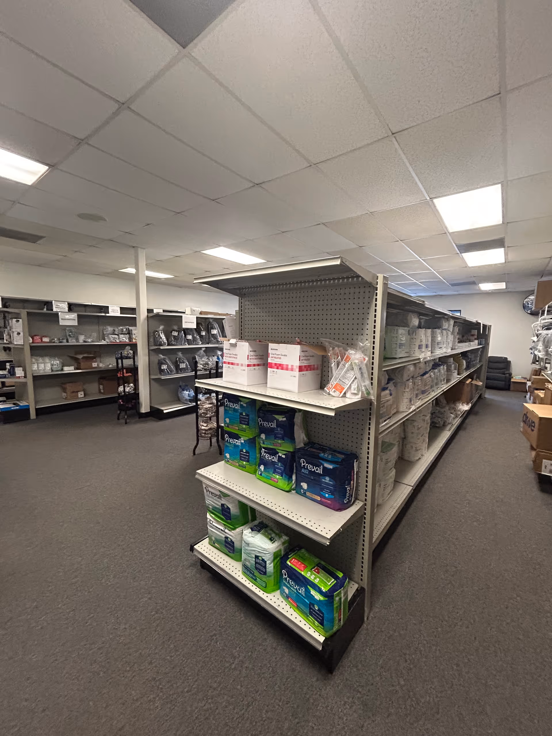 A storage room at Aldo Home Care and Medical Supply with stocked shelves of medical supplies.