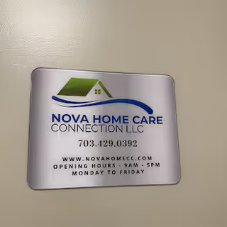 Indoor wall plaque displaying Nova Home Care Connection LLC logo and contact information.
