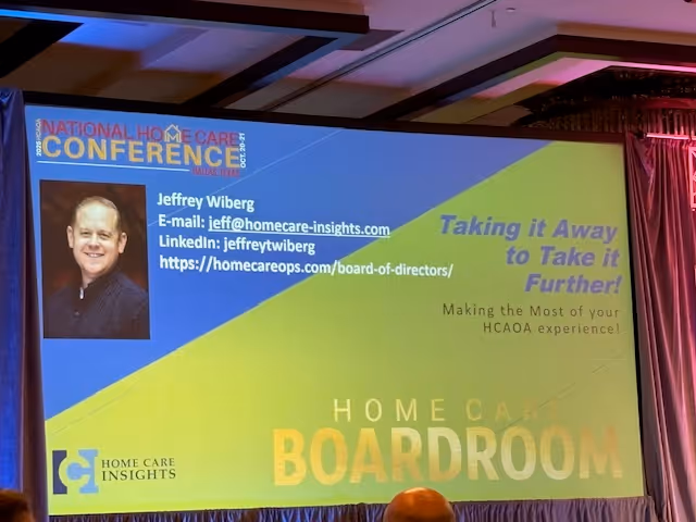 Large conference screen shows a speaker portrait and vibrant Home Care slide graphics.