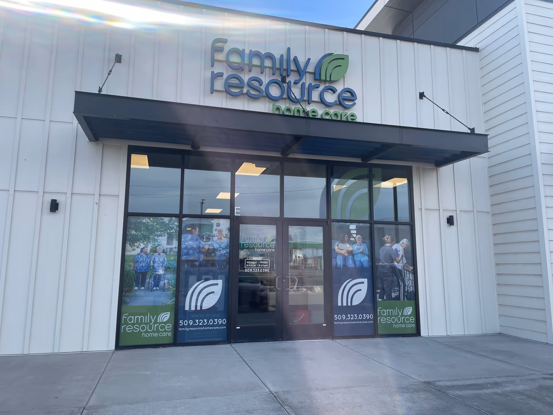 Exterior view of Family Resource Home Care facility entrance with glass doors.