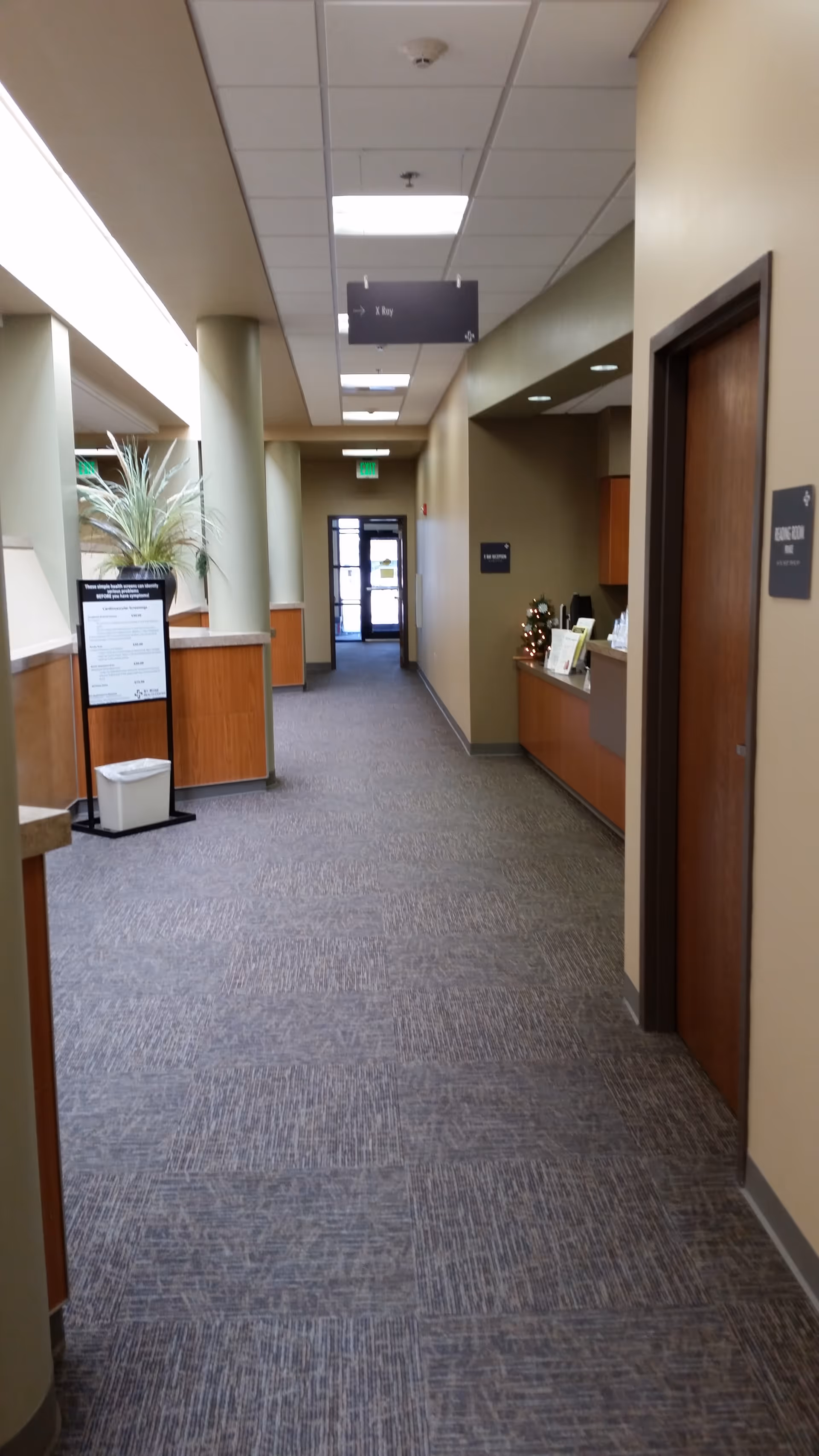 Long interior hallway of St. Rose Health Center with reception desk.