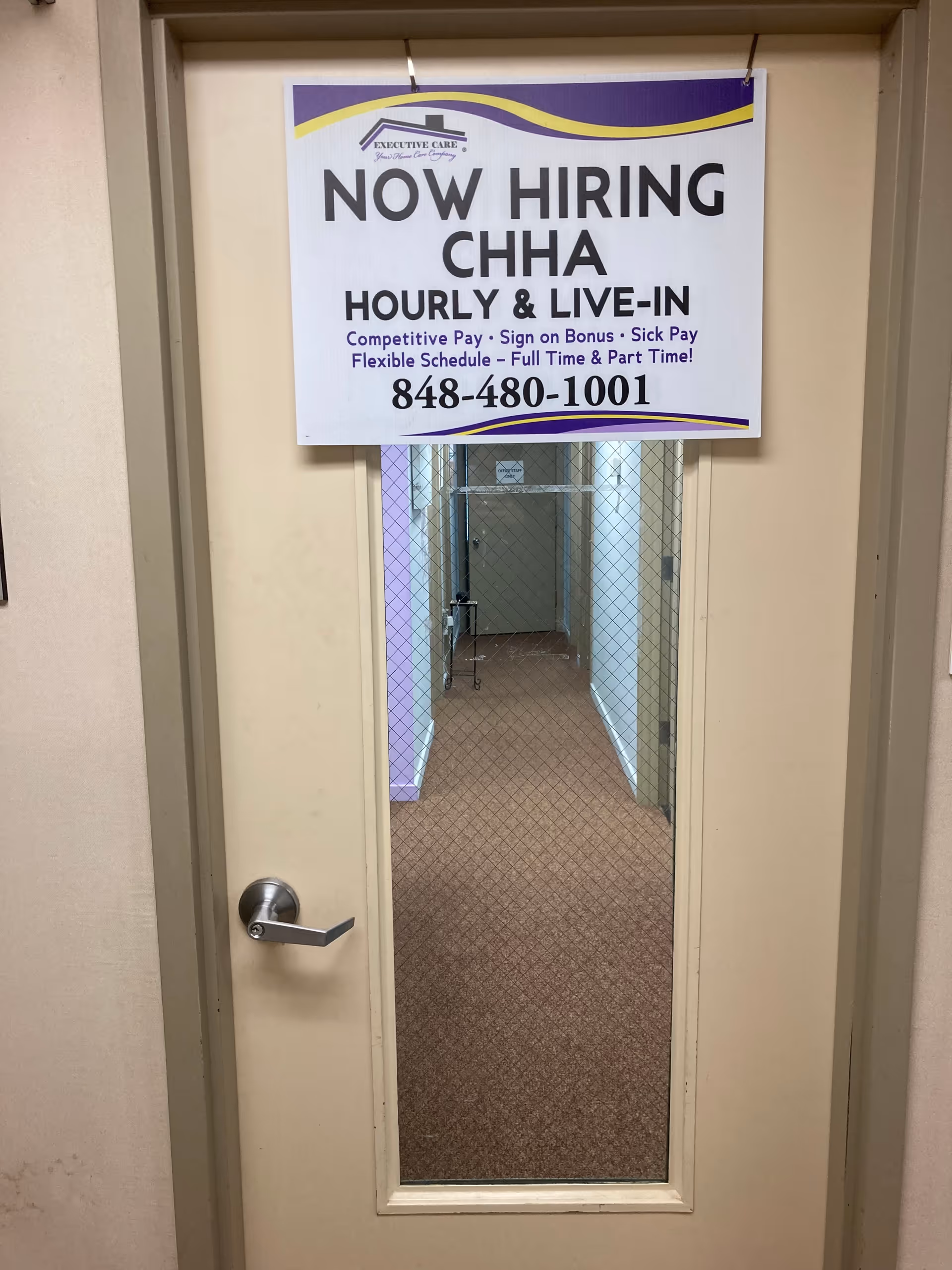 Narrow interior hallway with a 'Now Hiring' CHHA sign on the doorway.