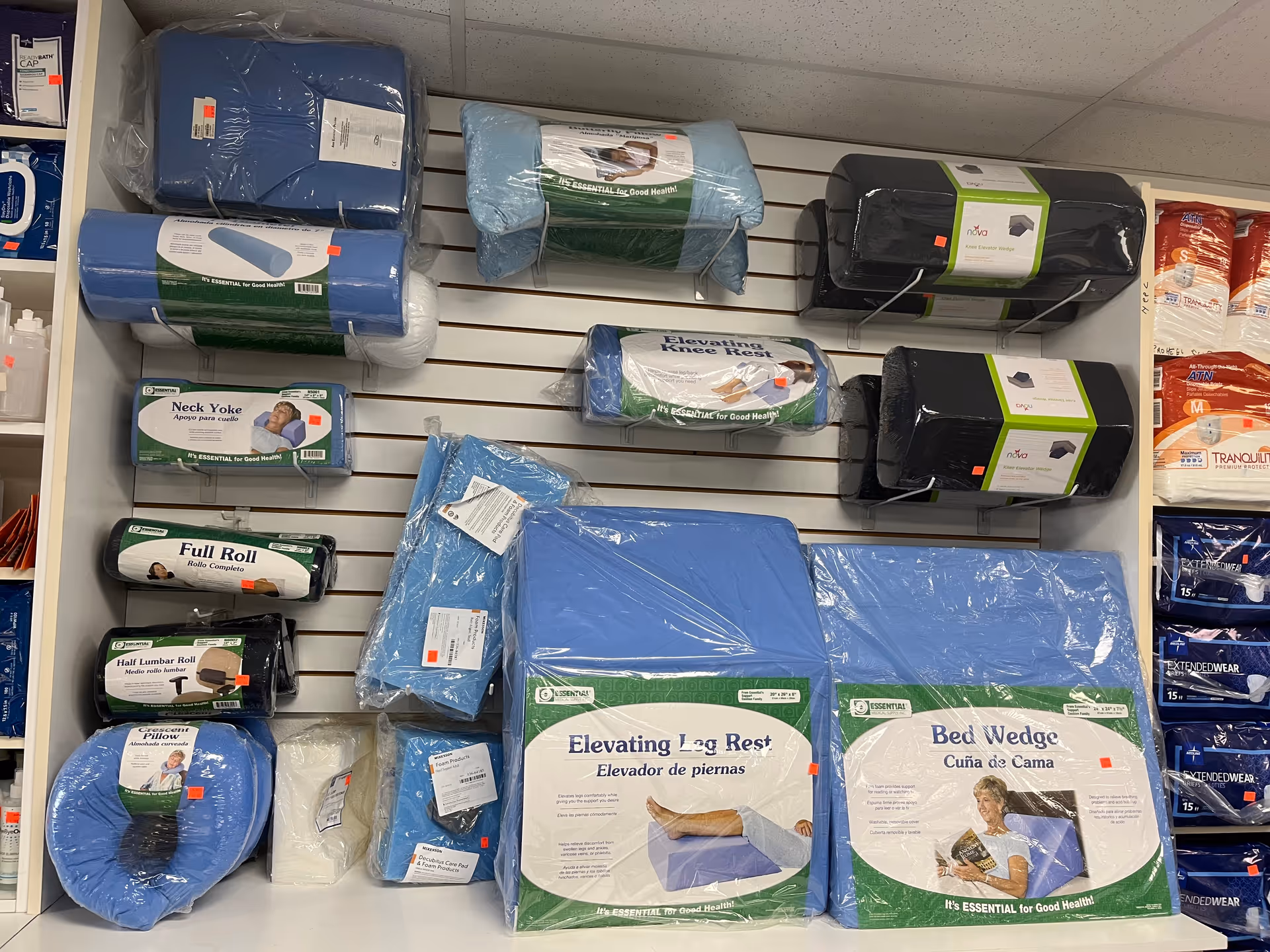 Interior storage area showing blue medical cushions, bed accessories, and mobility aids on shelves.