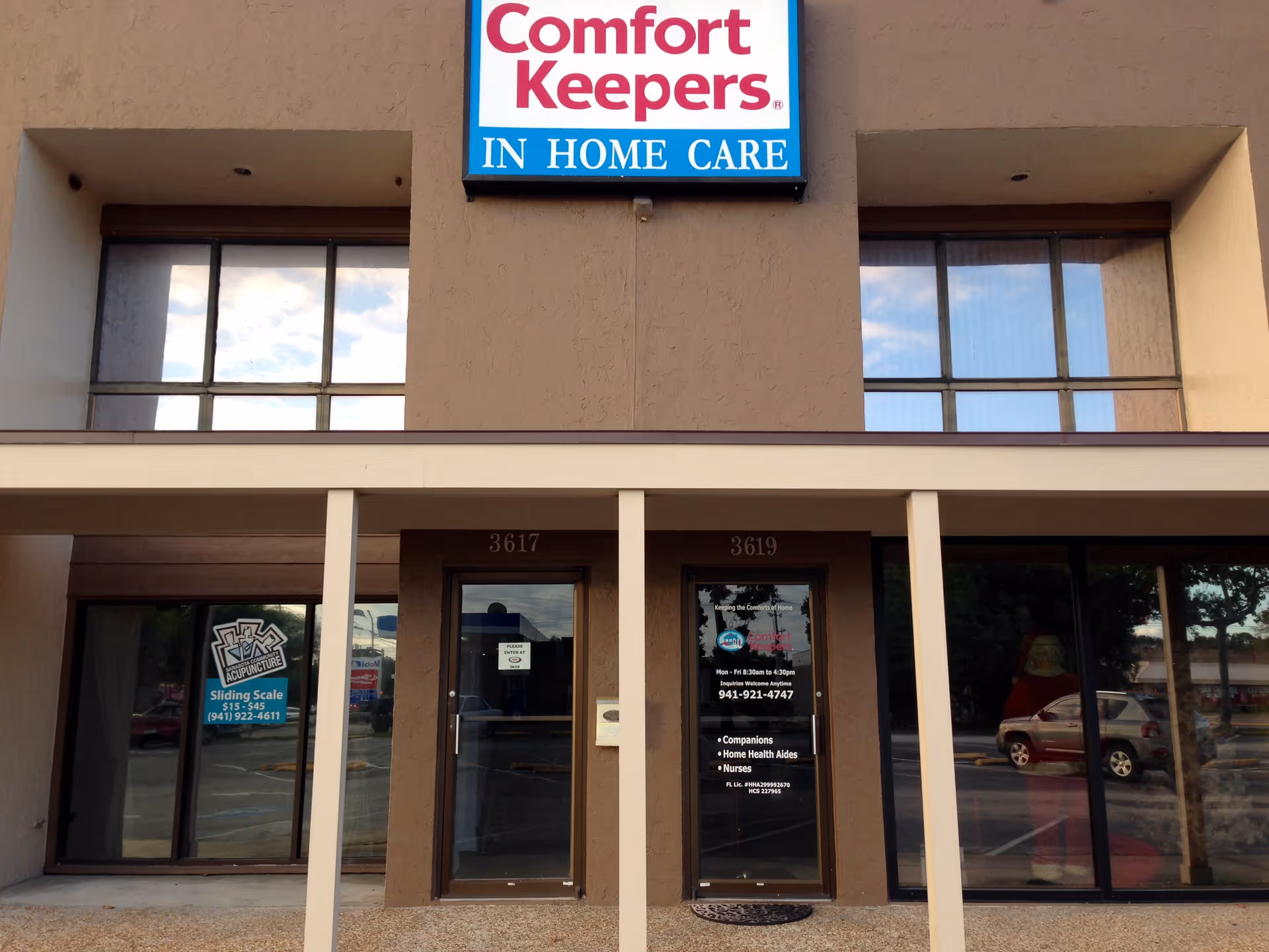 Facade of Comfort Keepers building with large windows and entrance doors.