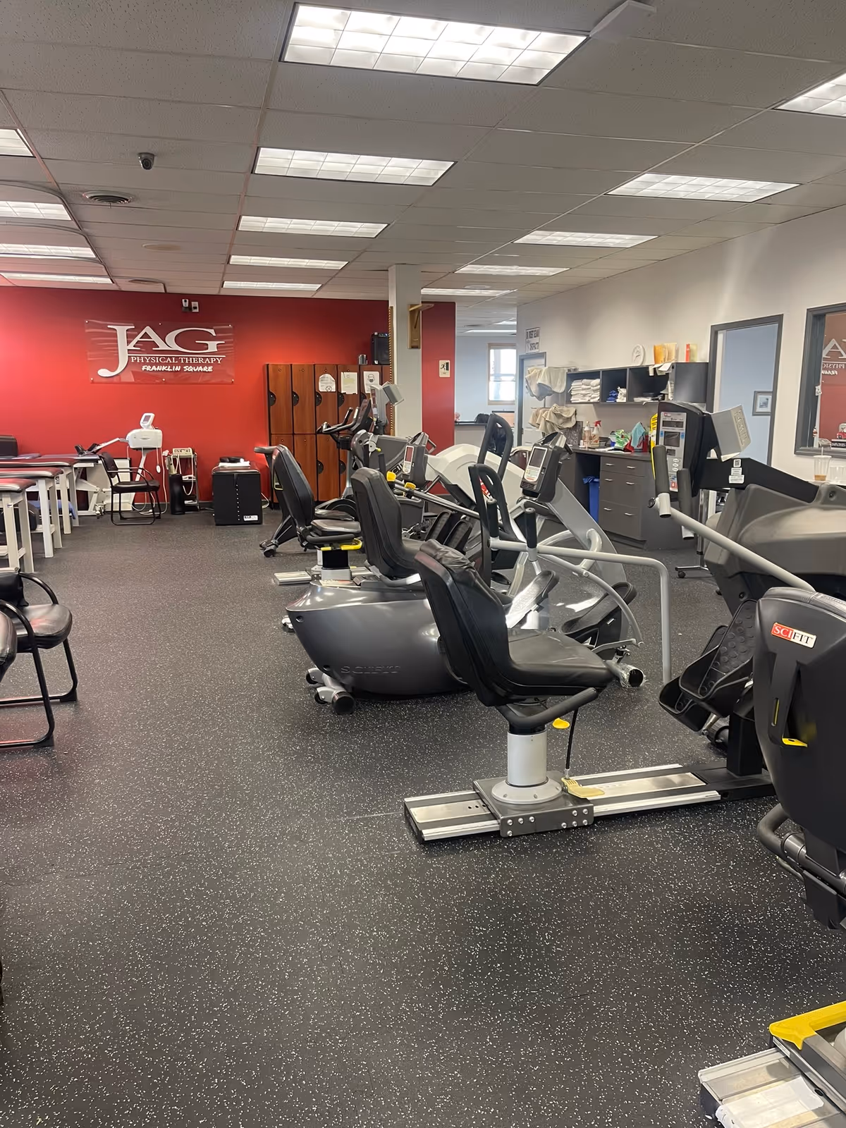 Indoor JAG Physical Therapy gym with exercise bikes and rehab equipment.
