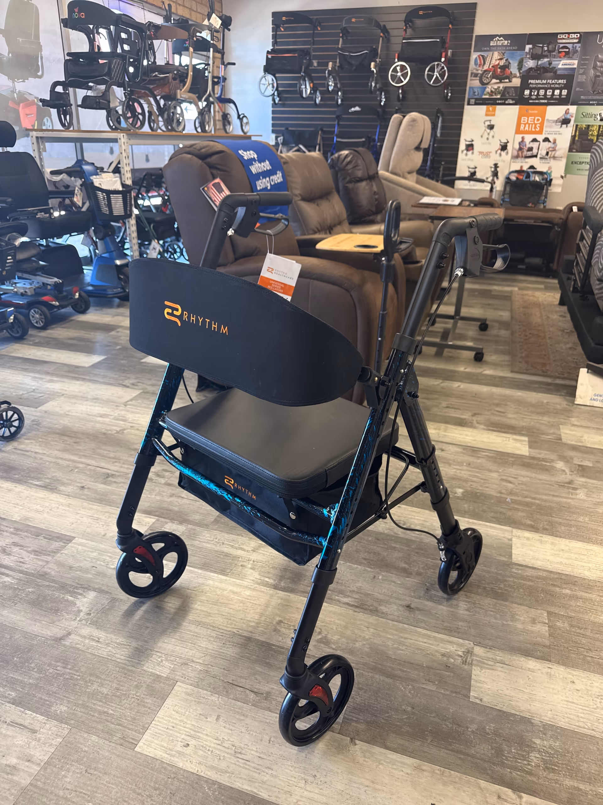 Rollator walker on display in Gallant Medical Supply showroom, with recliners and mobility devices.